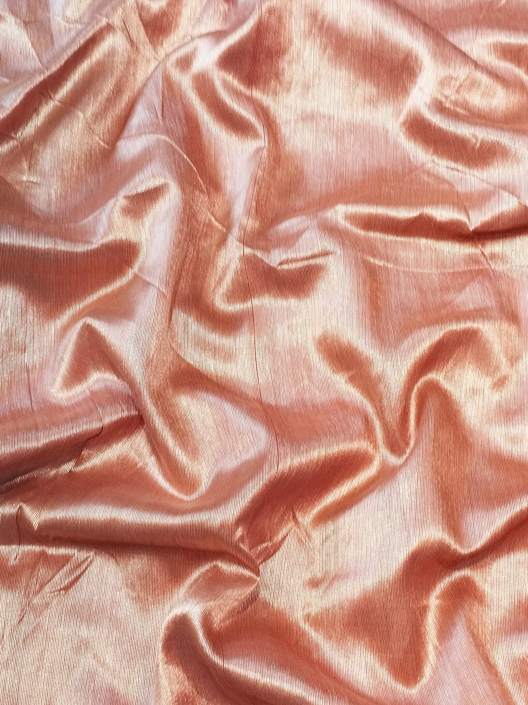 Textured slub tussar silk fabric in soft peach color