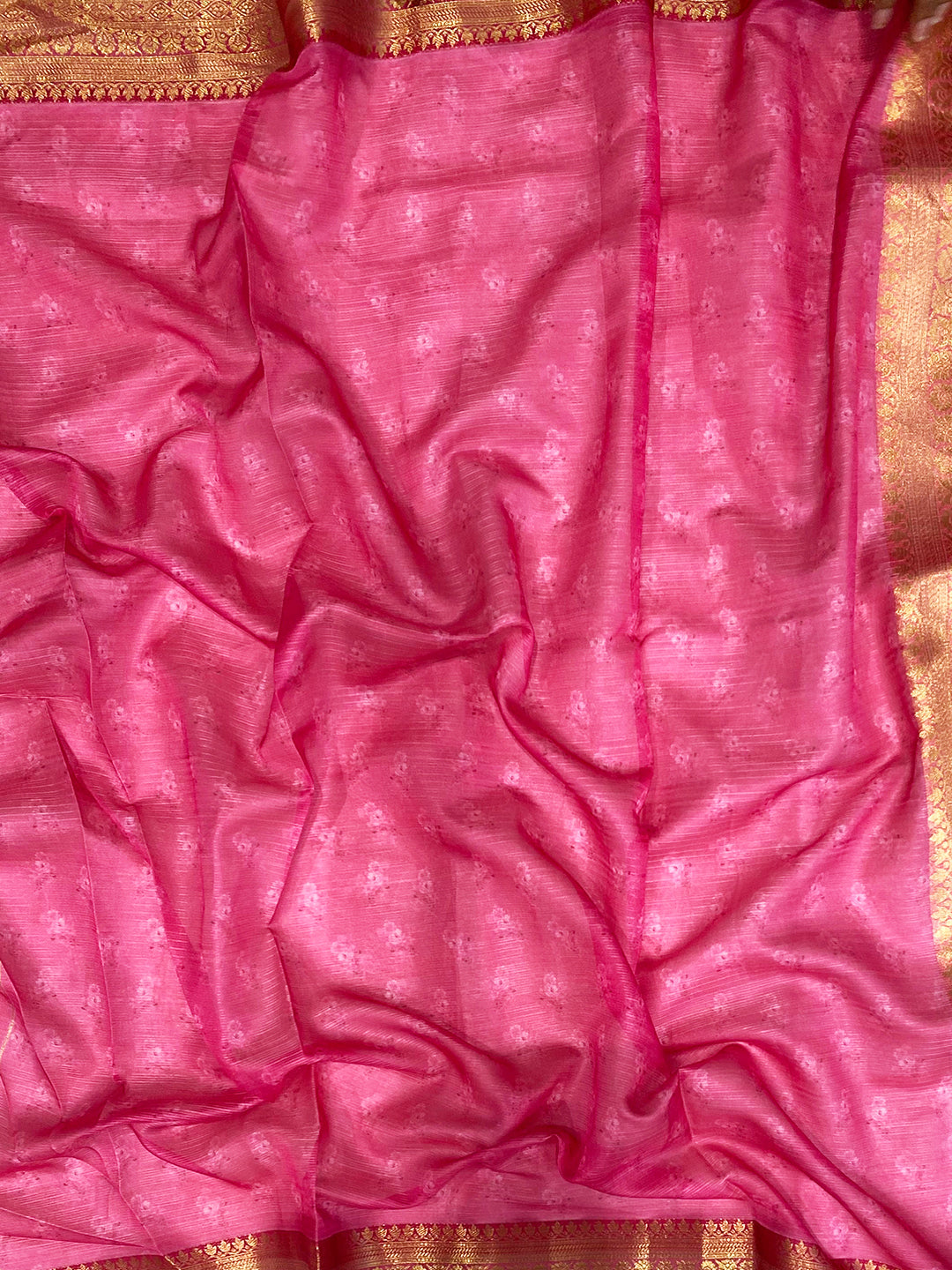 Close-up of pink and gold border on Kota silk saree