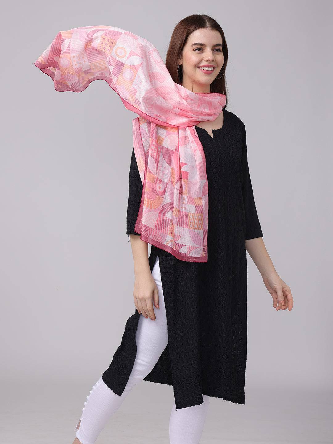 Airy pink geometric scarf in motion with abstract design.