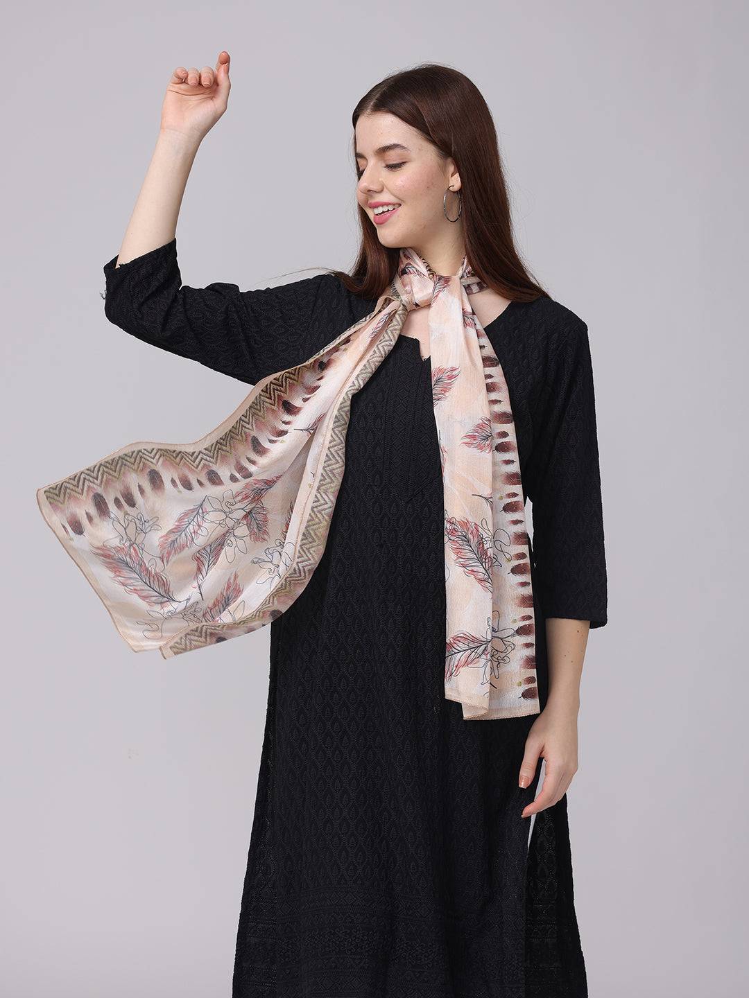 Model wearing feather pattern geometric borde scarf, side view