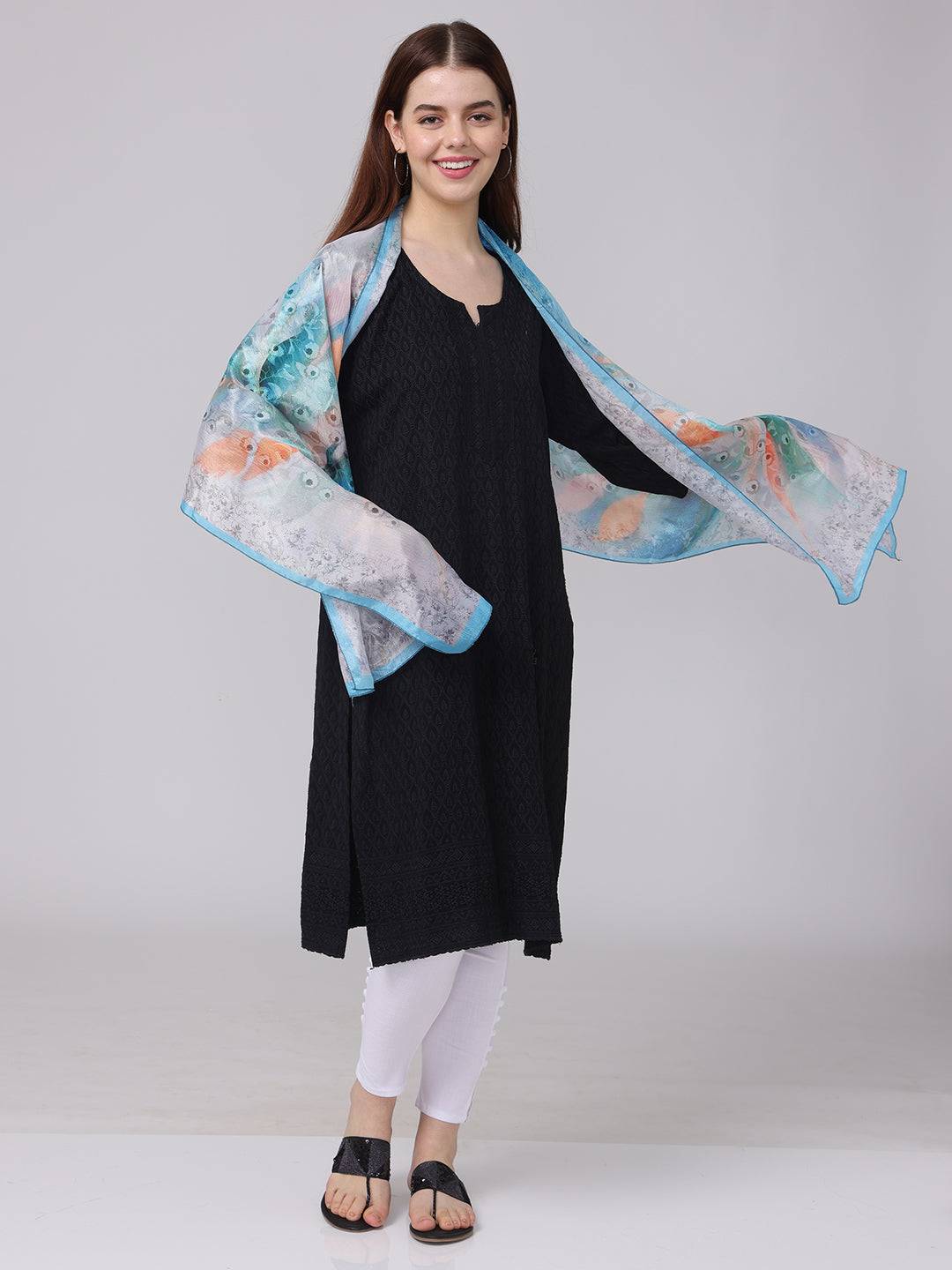 Model wearing Vibrant Aqua Dream Scarf with abstract design