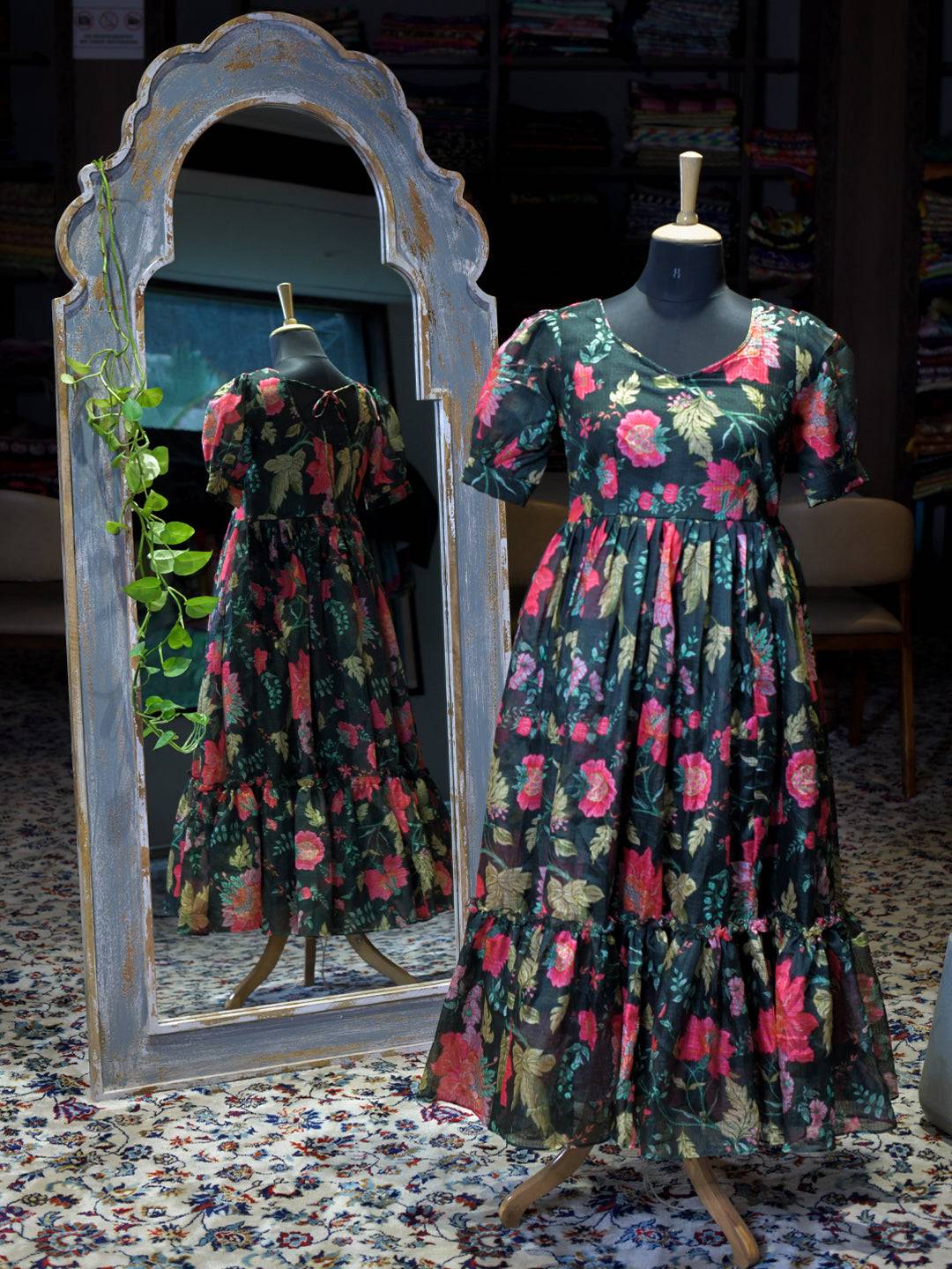 Revan Black Floral Print Midi Dress on mannequin with mirror