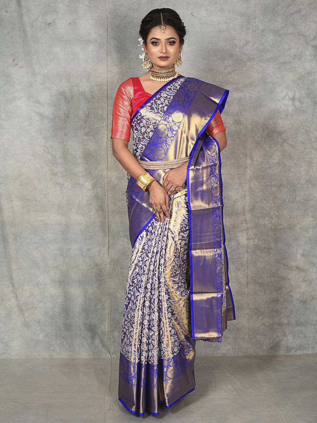 Elegant Royal Blue Silk Saree featuring gold tissue and floral designs.