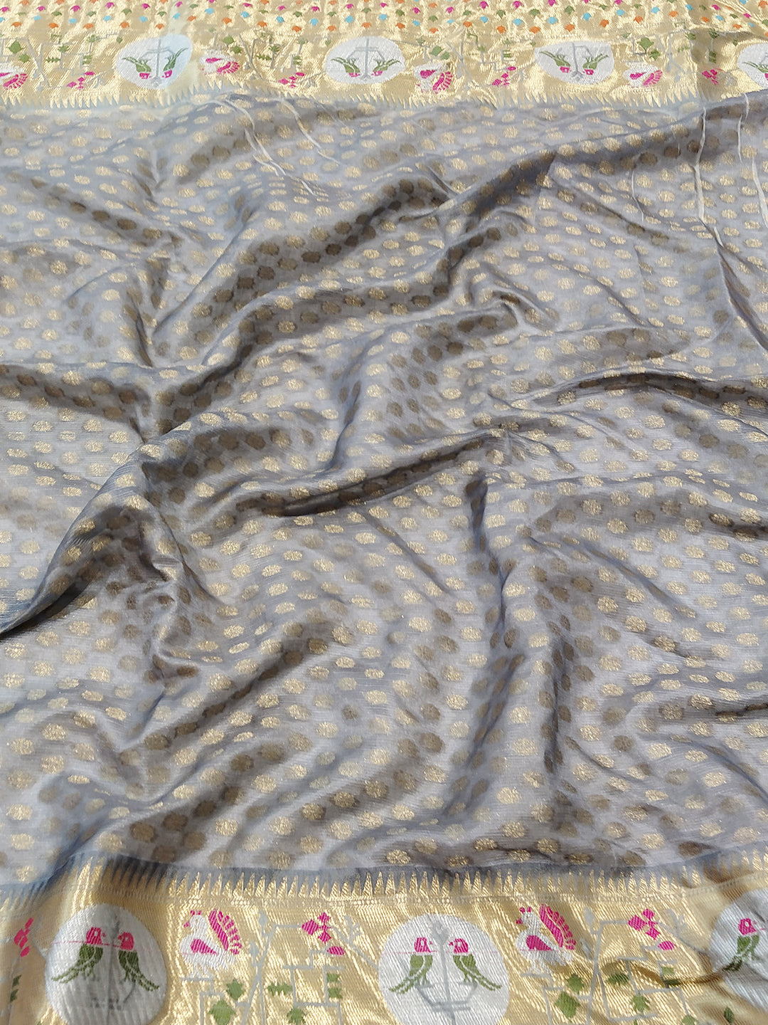 Close-up of Kota Doria silk saree fabric with intricate patterns