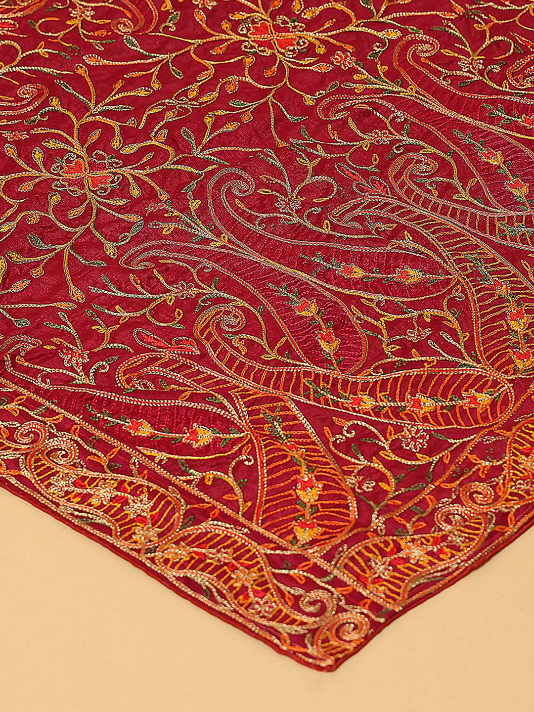 Close-up of wine color chiffon dupatta with resham thread motifs.