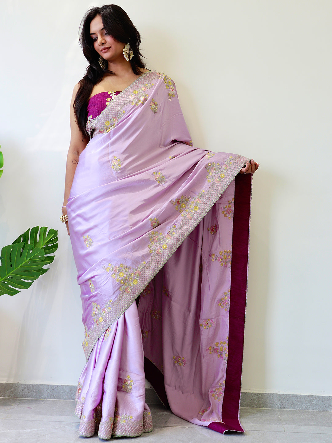 Model showcasing silk saree with intricate embroidery