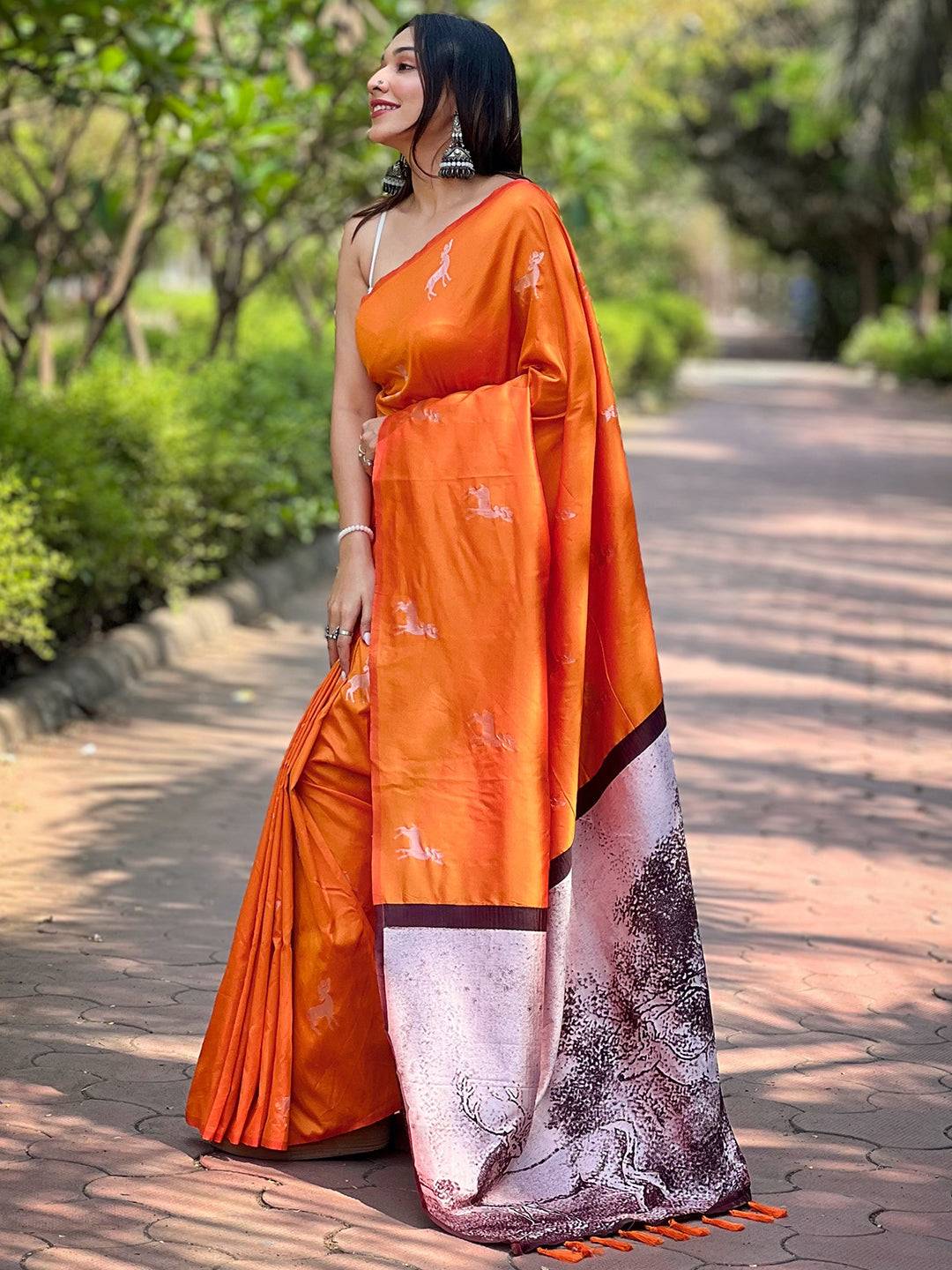 Side view of orange soft silk saree with intricate pallu