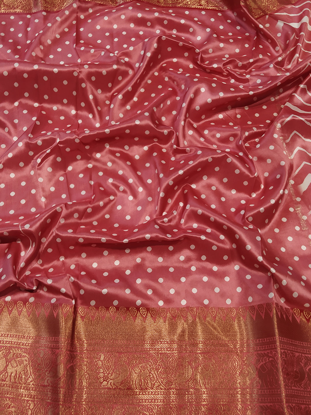 Close-up of Kanchi Zari Border Leheriya Saree with polka dot detail