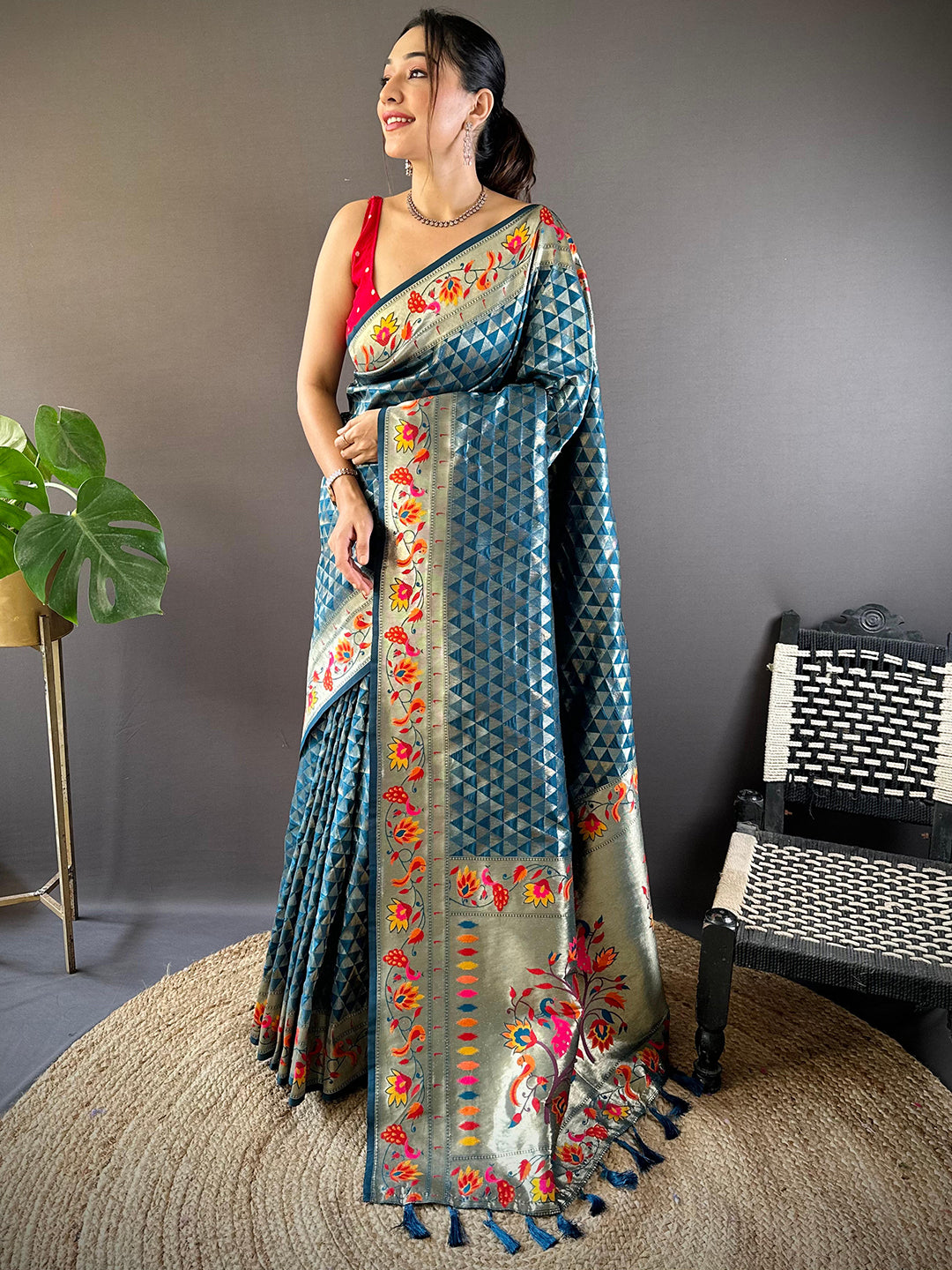 Model wearing denim silk blend Paithani saree with intricate zari