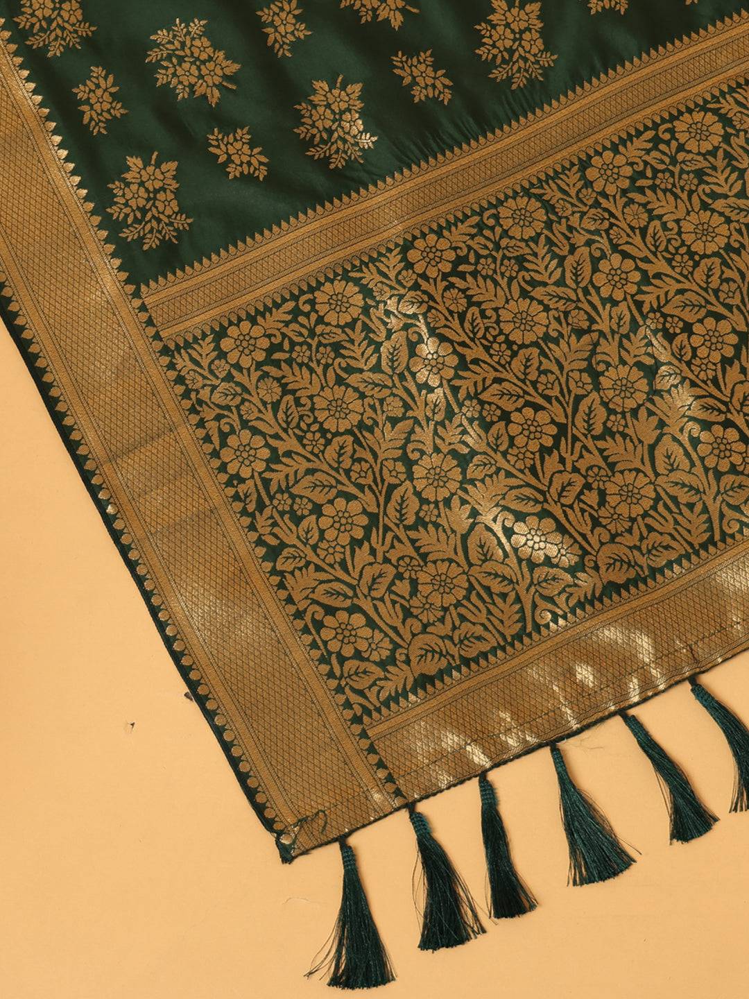 Close-up of woven design on dark green dupatta