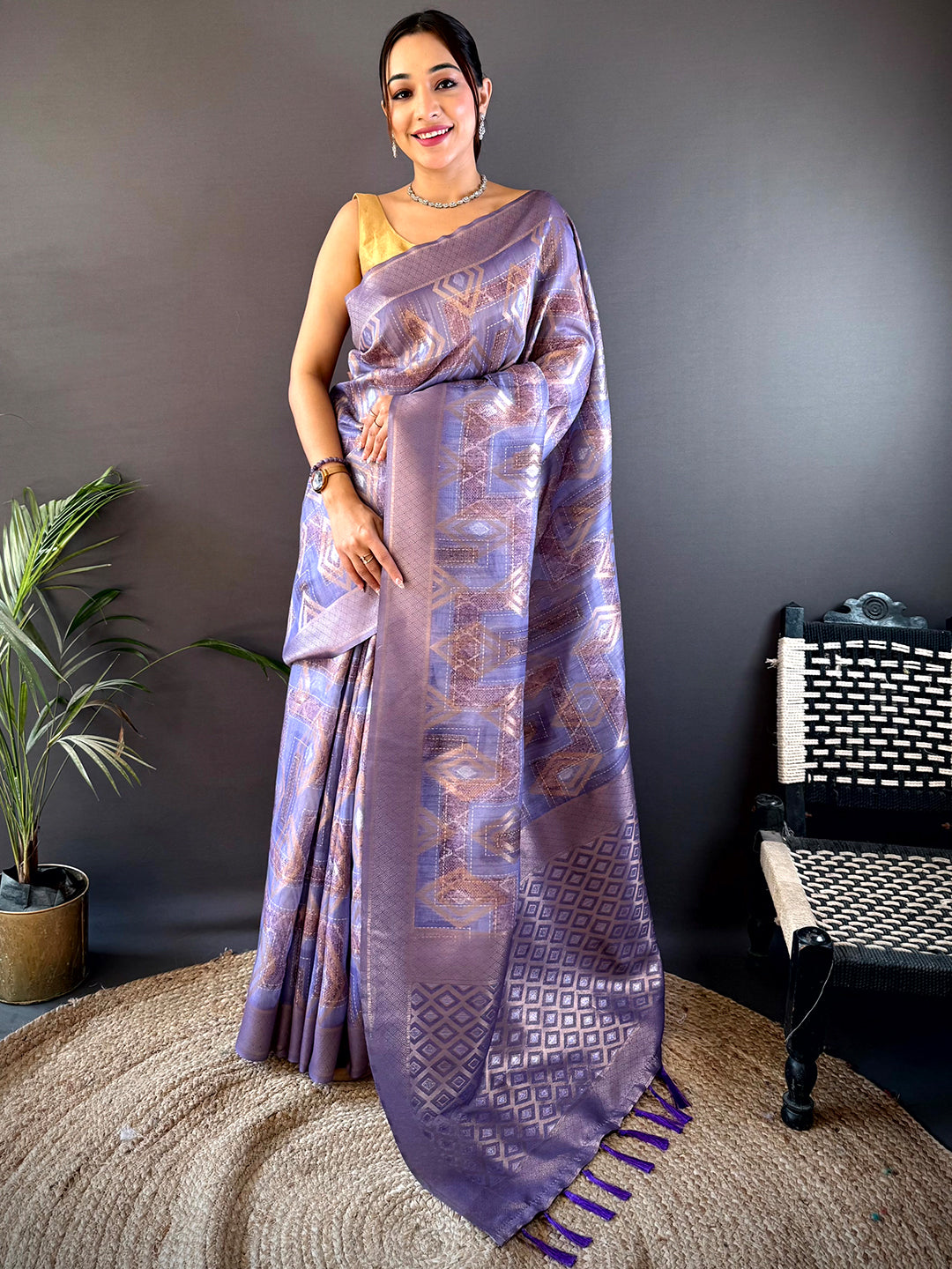 Shop Lavender Banarasi Silk Katan Geometric Saree featuring rich gold weaving and a luxurious drape, ideal for parties and celebrations.