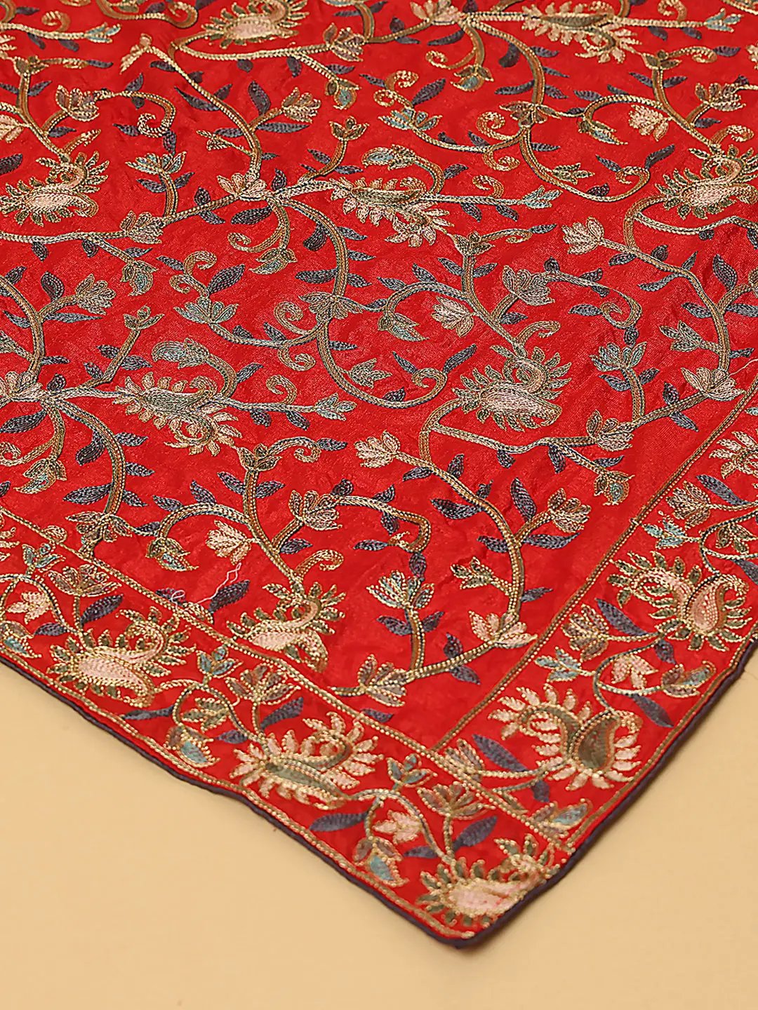 Close-up of red dupatta with resham thread embroidery