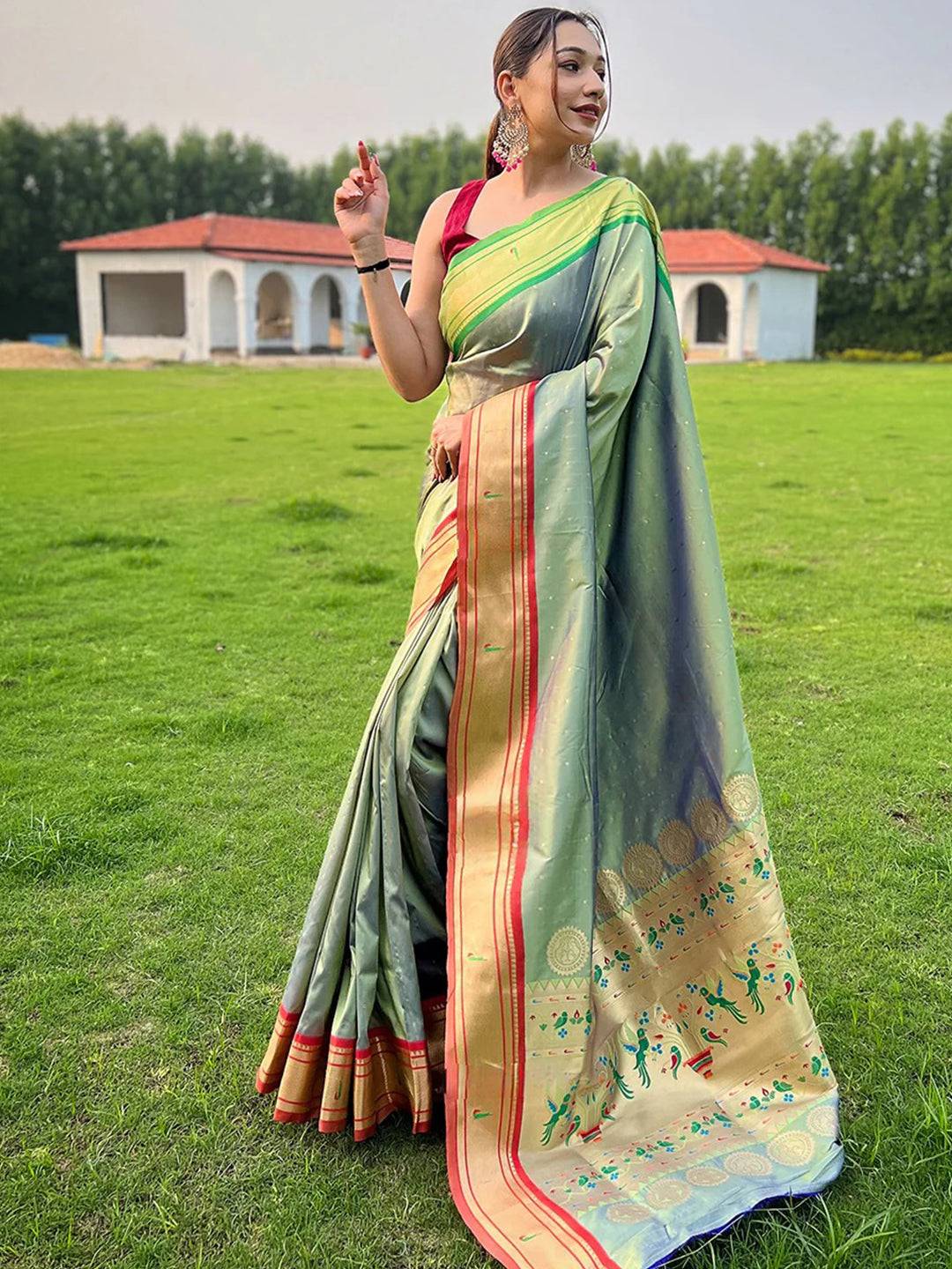 Full view of light green Paithani saree with intricate pallu design.