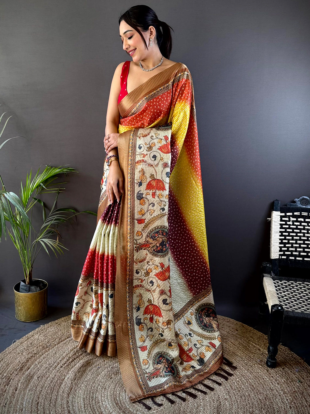 Elegant Silk Blend Bandhani Print Saree with a mix of warm tones and detailed motifs, perfect for festive and wedding occasions.