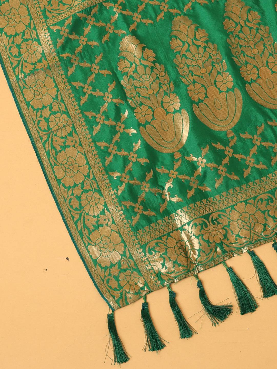 Close-up of green silk blend dupatta with gold woven motifs