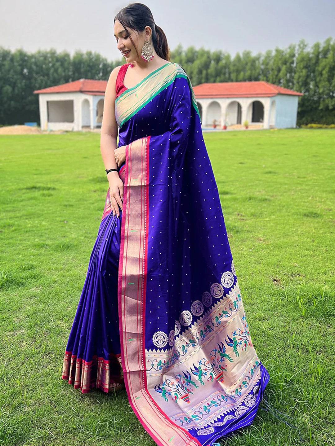 Elegant violet Paithani saree showcasing rich pallu design