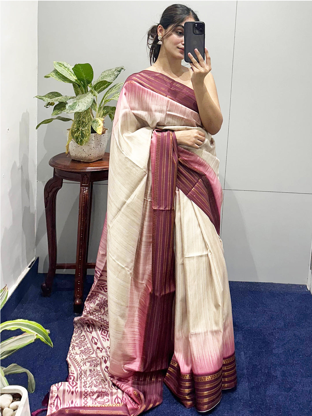 Selfie of woman in wine Ikkat Ghicha saree indoors