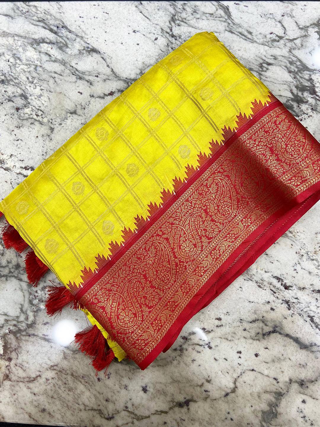 Sunshine Yellow Kovai Banarasi Silk Saree on marble surface