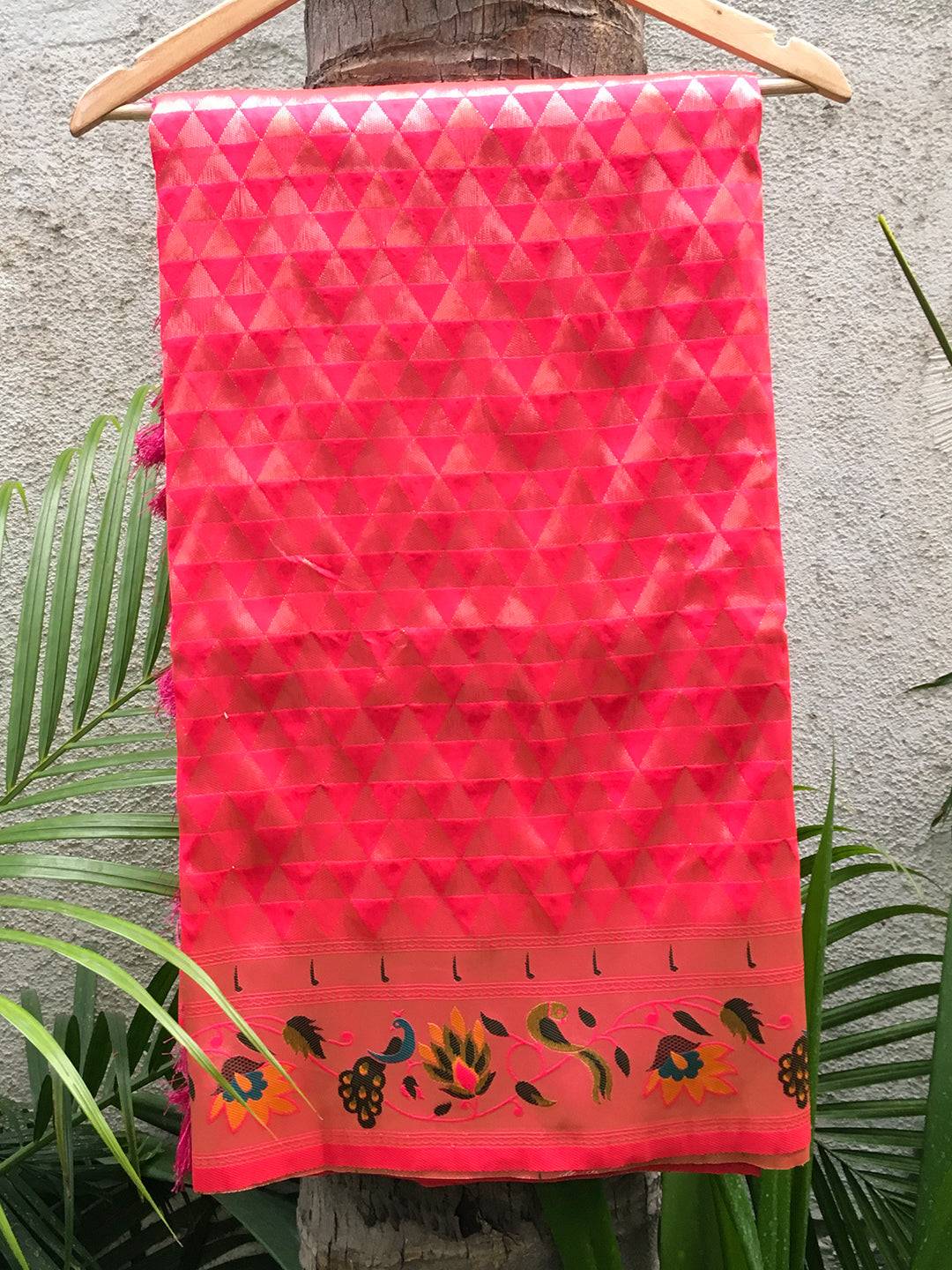 Pink silk blend Paithani saree with floral zari work on hanger