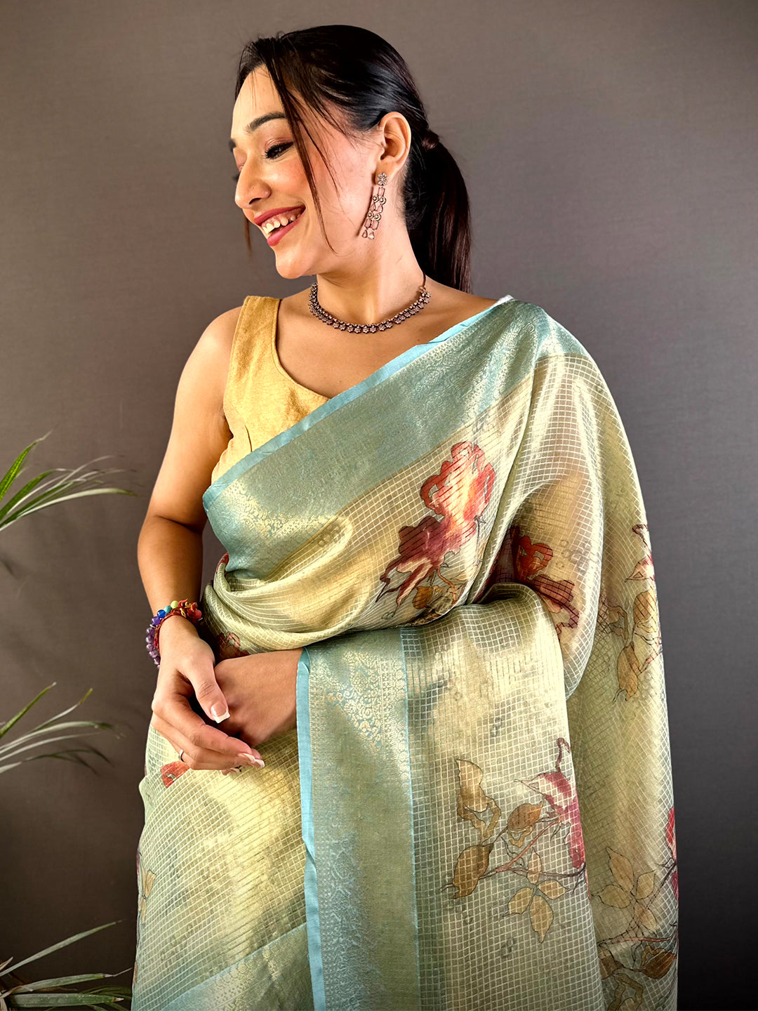 Stylish Green Self Gold Zari Floral Print Saree