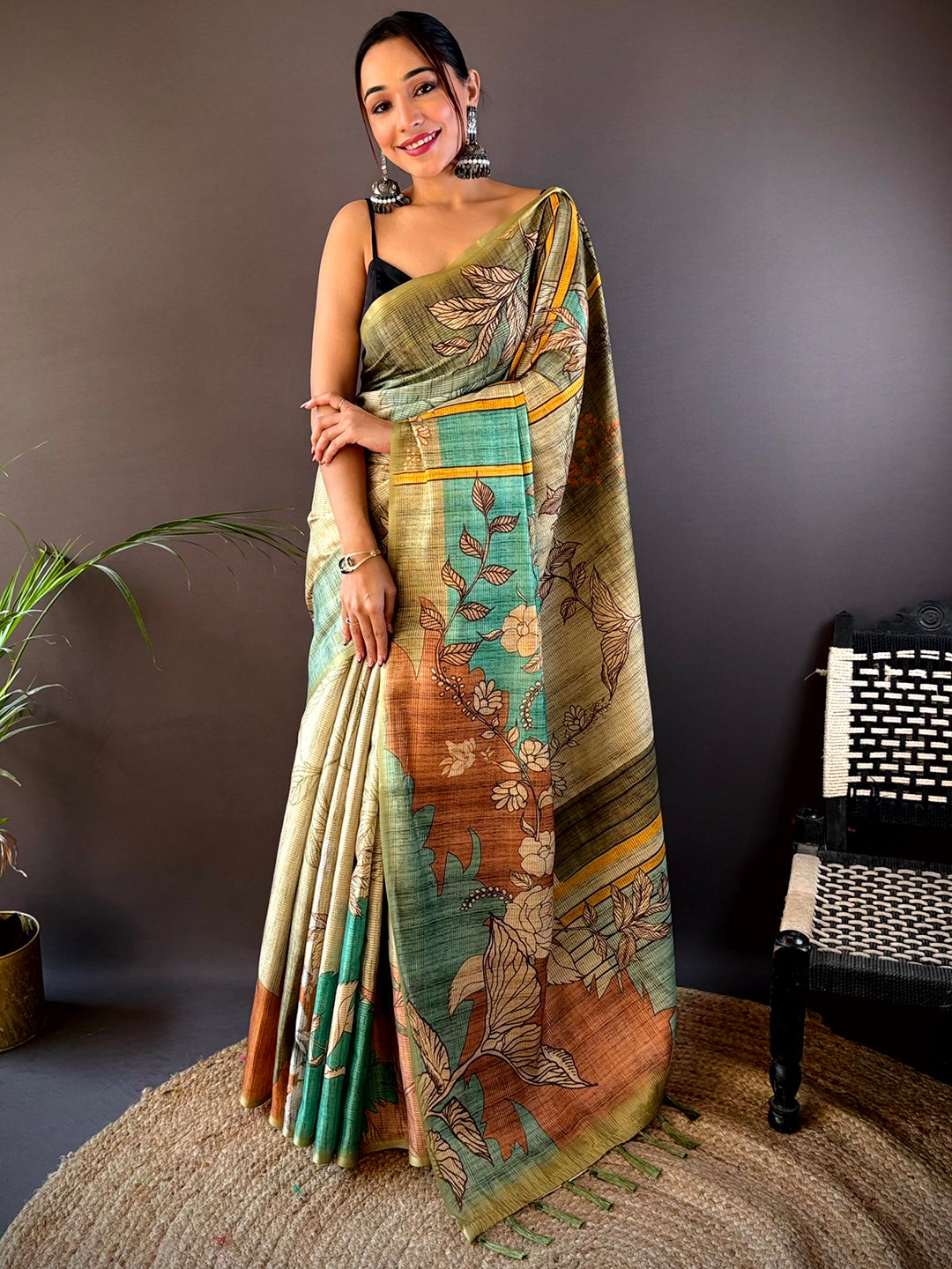 Elegant green tussar saree with abstract floral design.