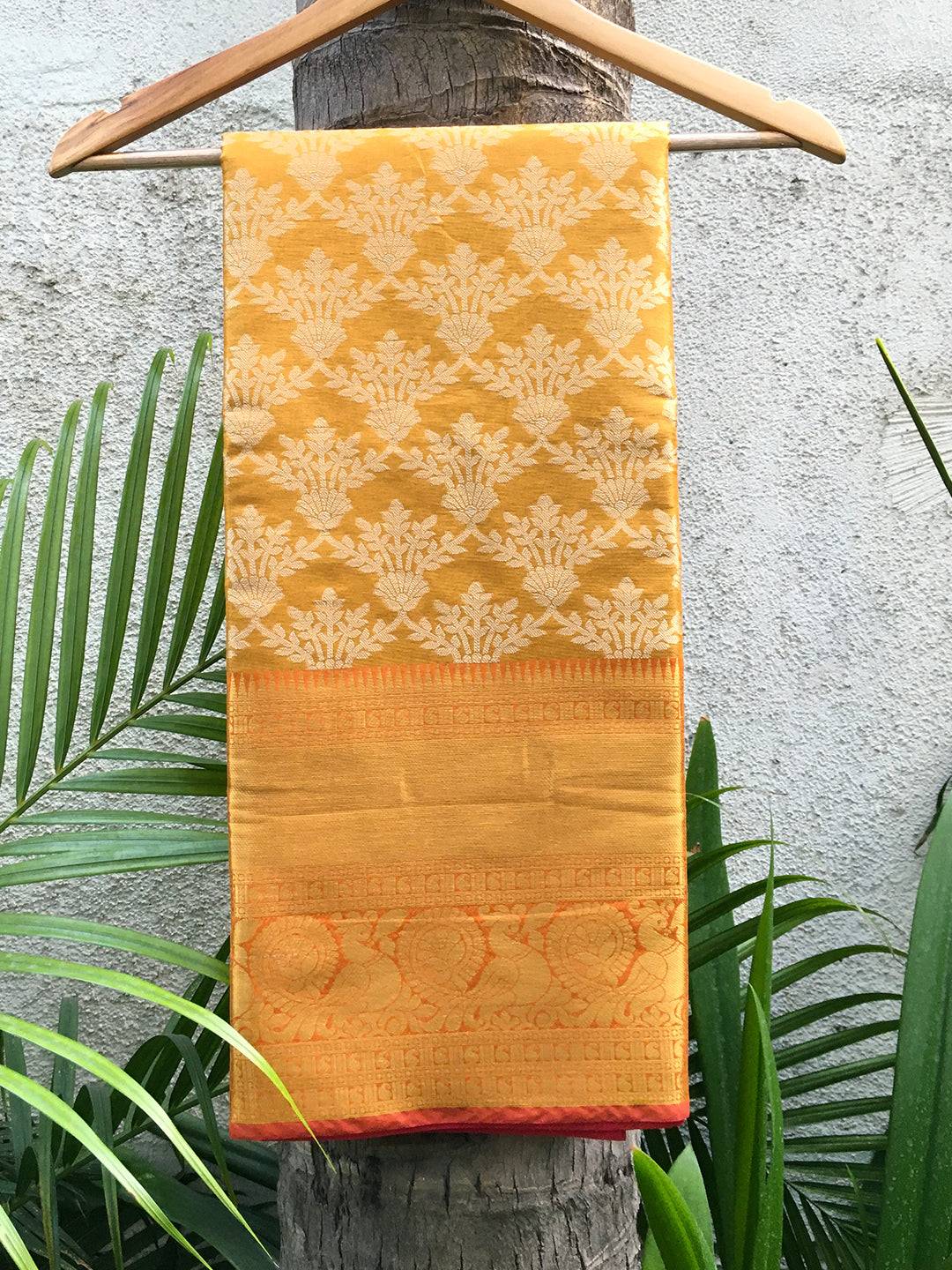 Trendy gold Kanjivaram soft silk saree with intricate motifs