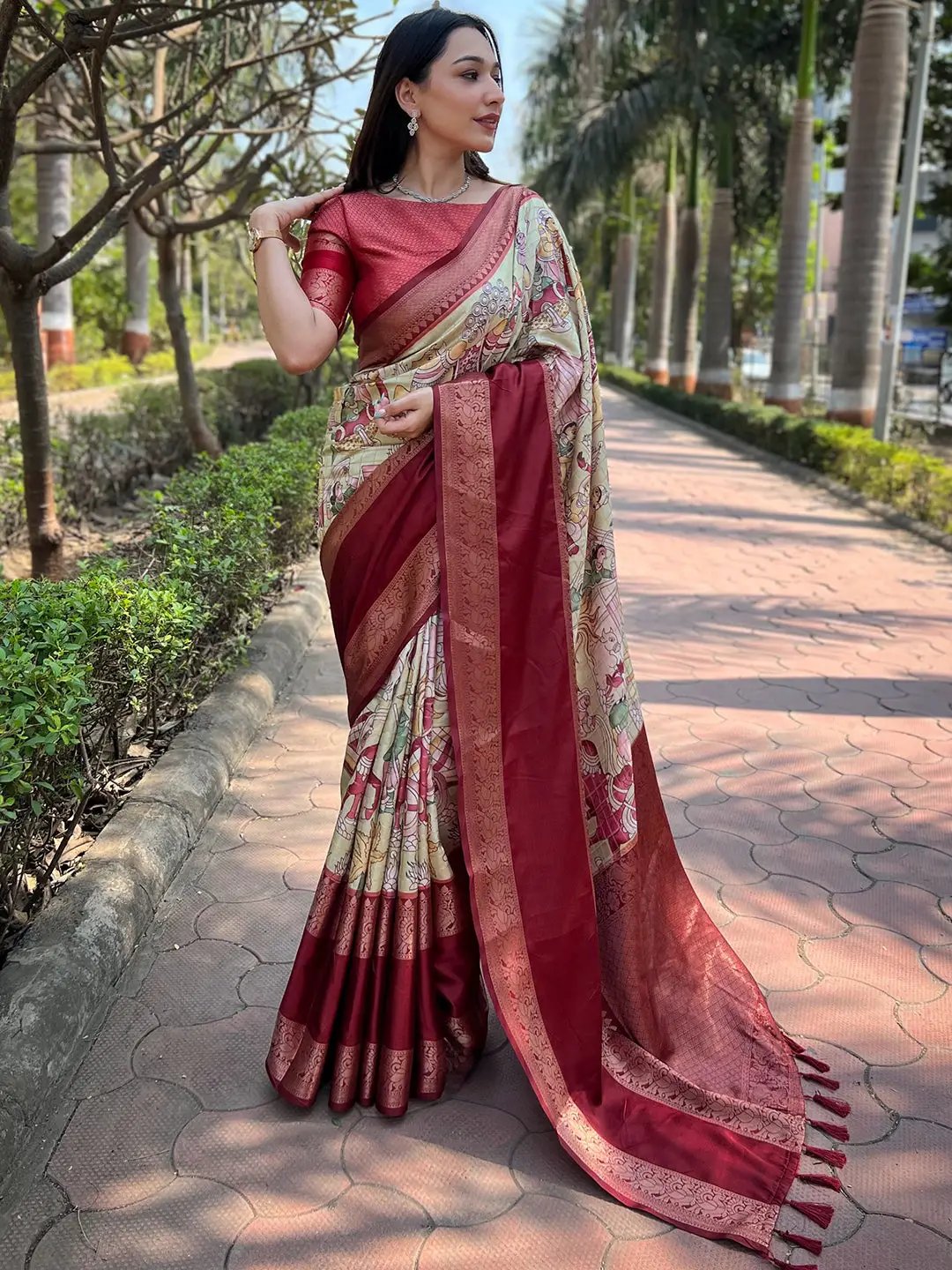 Elegant woman in red Banarasi silk saree with intricate design