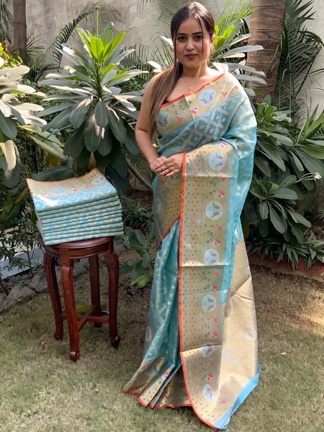 Model wearing Kota Doria Silk Minakari Patola Saree outdoors