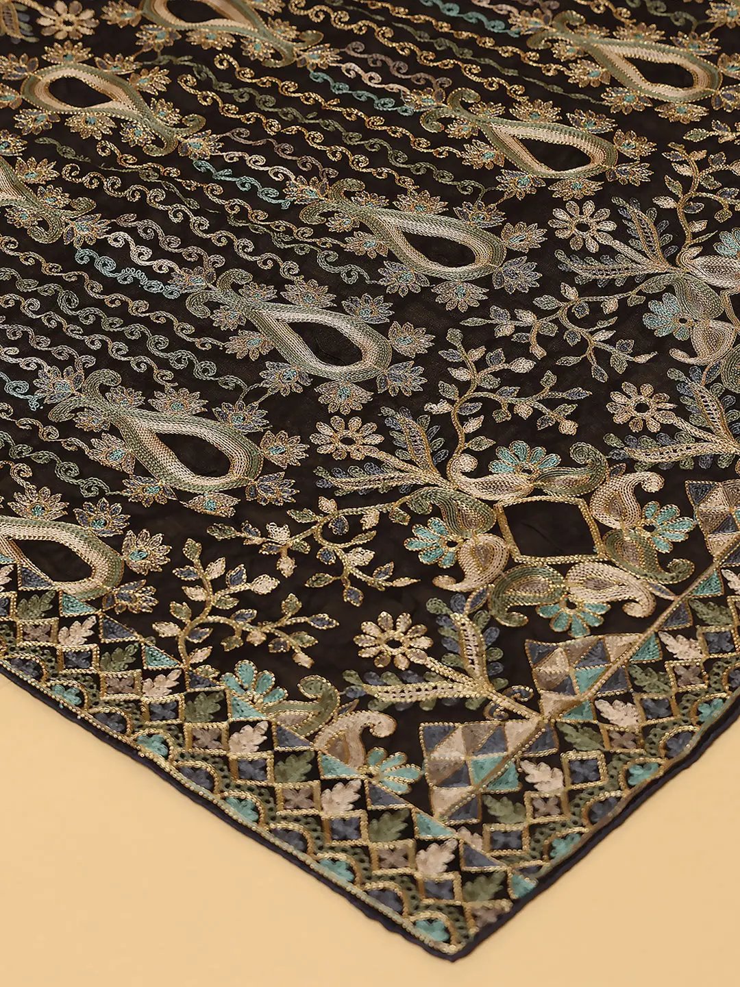 Close-up of black chiffon dupatta with floral embroidery.