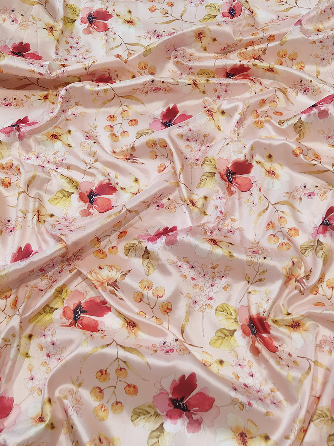 Close-up of peach floral print fabric of Kanjivaram saree