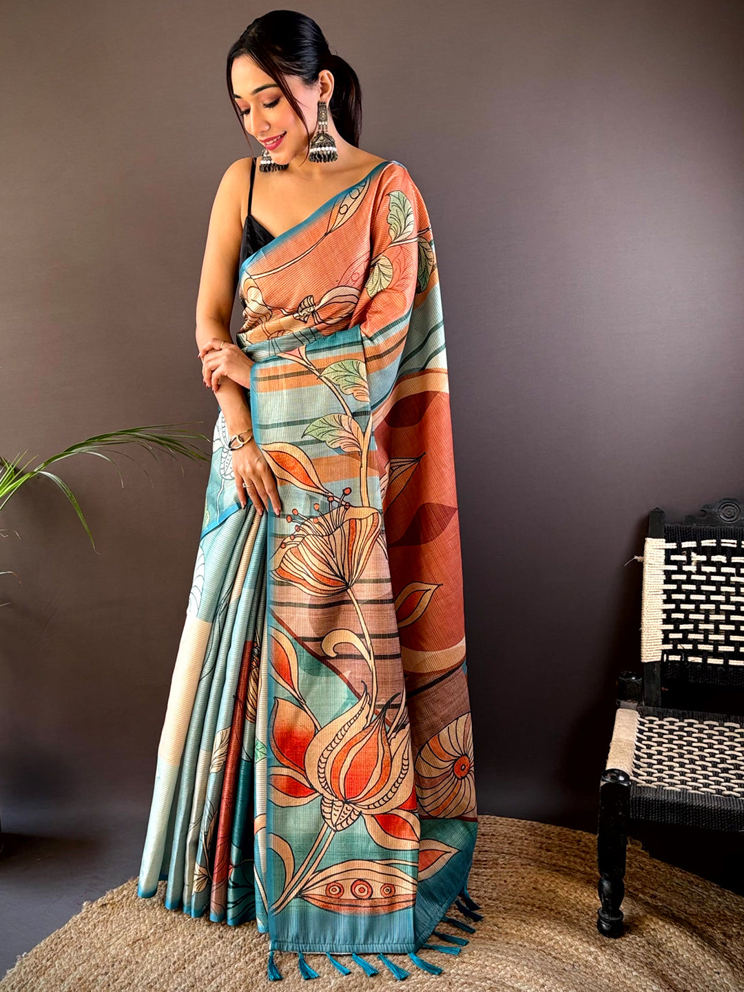 Full view of Teal Zari Tussar saree with abstract floral print.