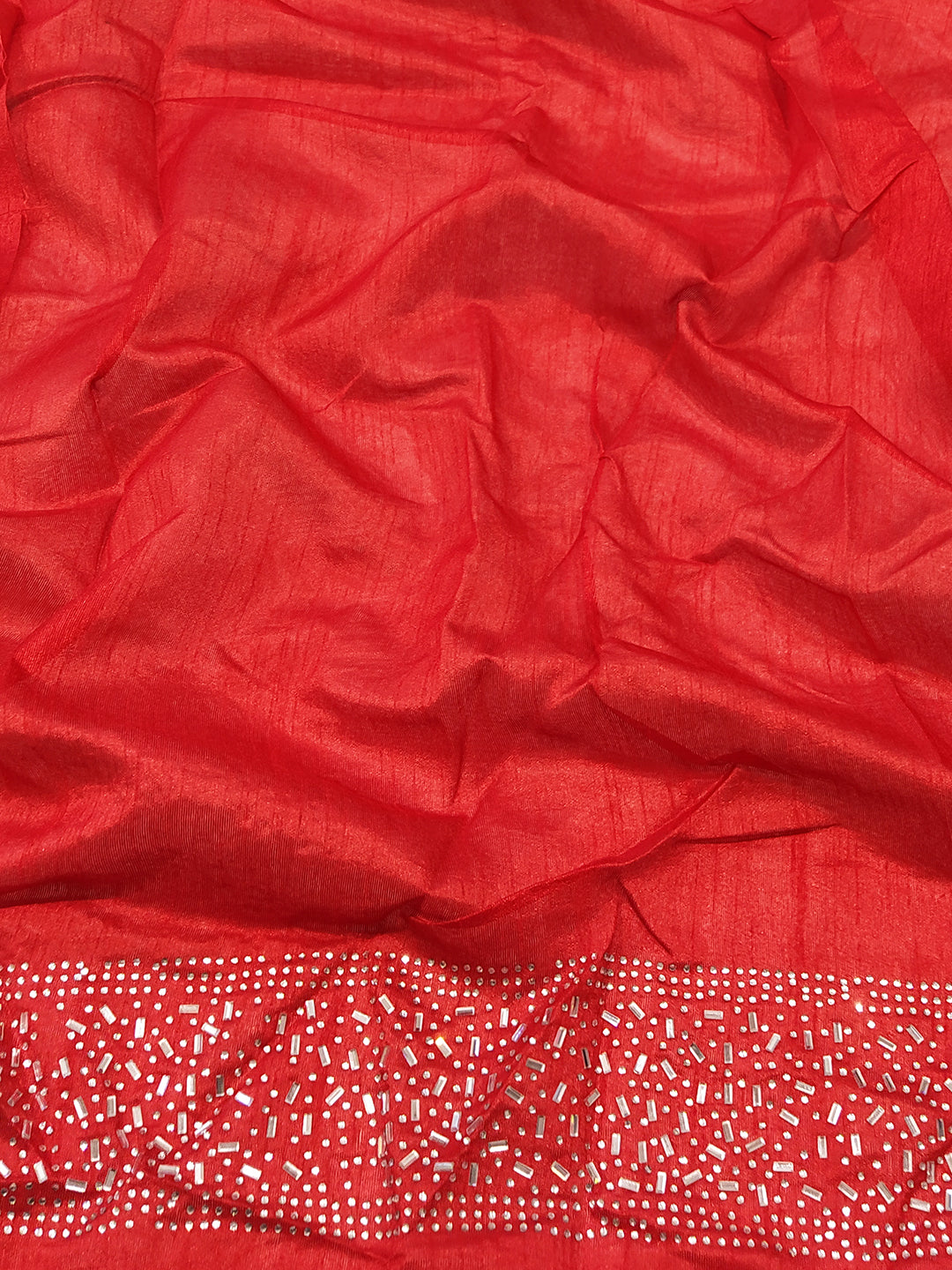 Red fabric detail with Swarovski stone embellishments