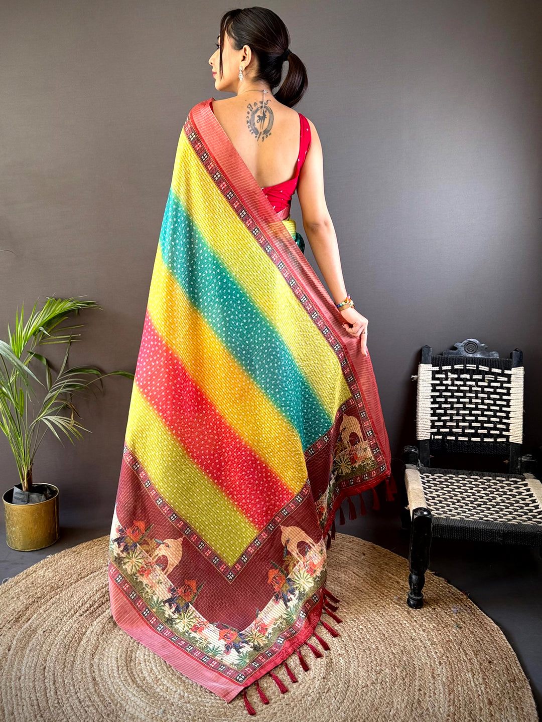 Back view of the Elegant Silk Blend Bandhani Print Saree showcasing its vibrant striped pattern and intricate border, ideal for festive occasions.