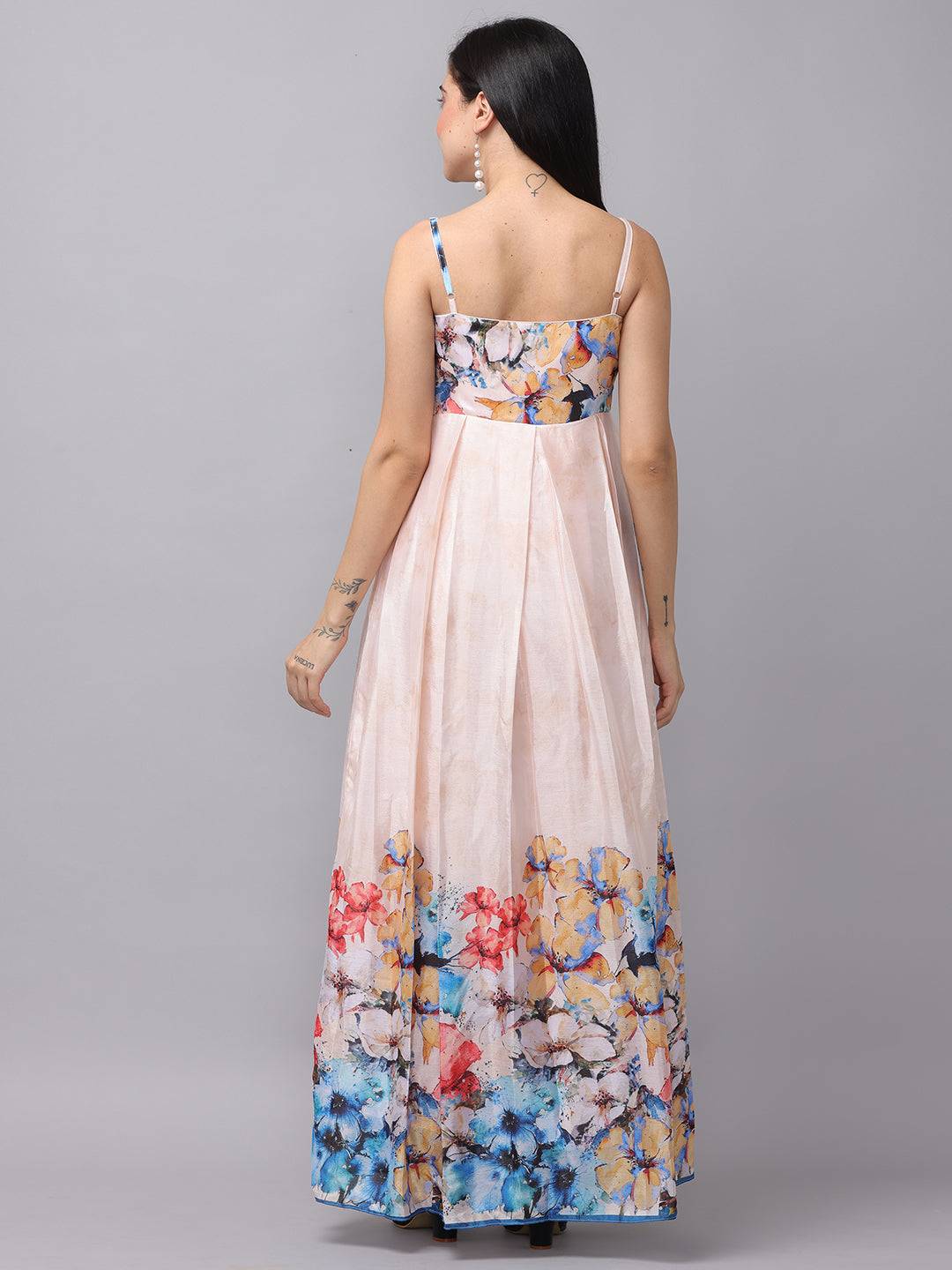 Back view of cream floral maxi dress with straps