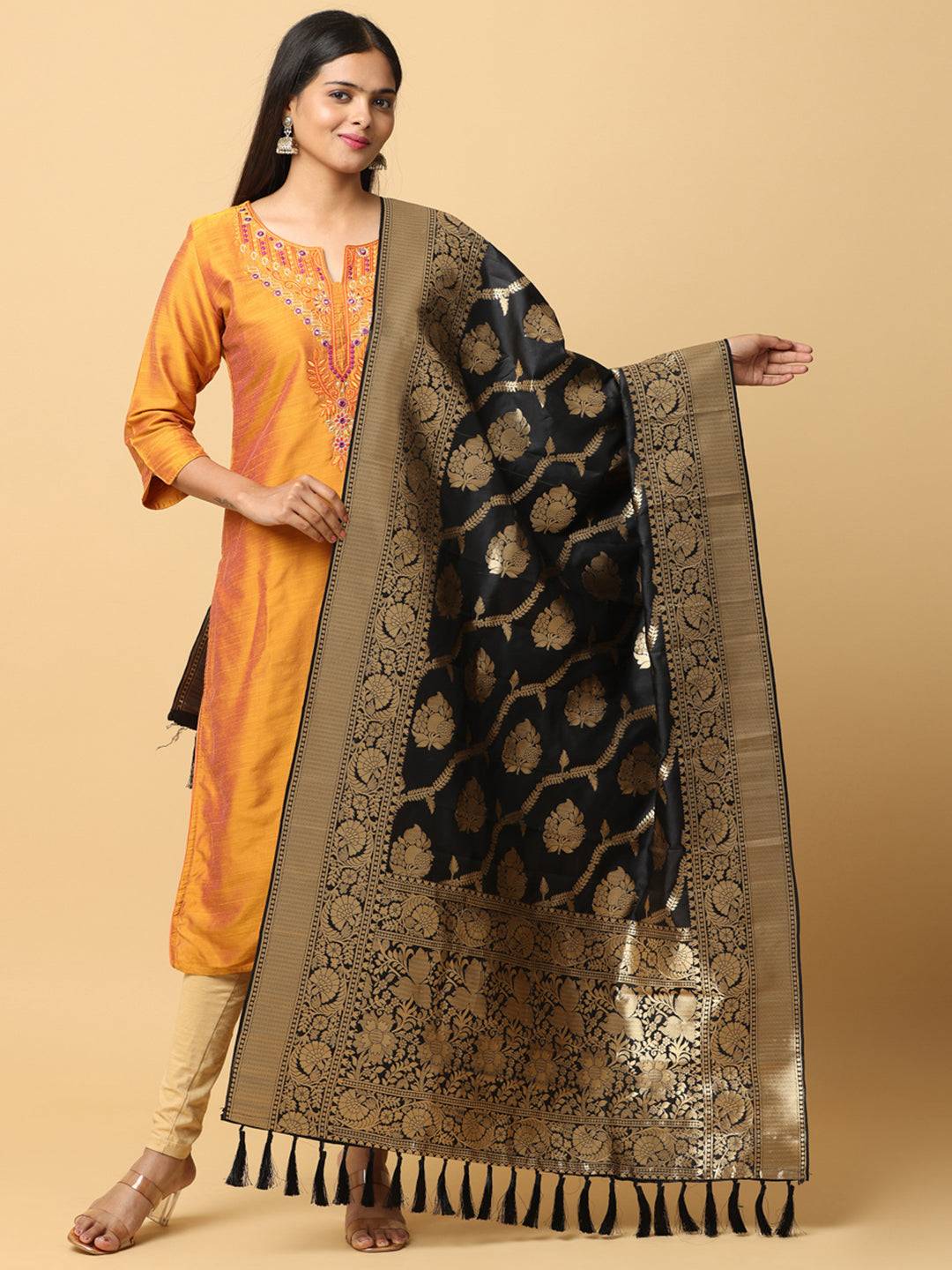 Black silk blend dupatta with woven design and resham tassels.