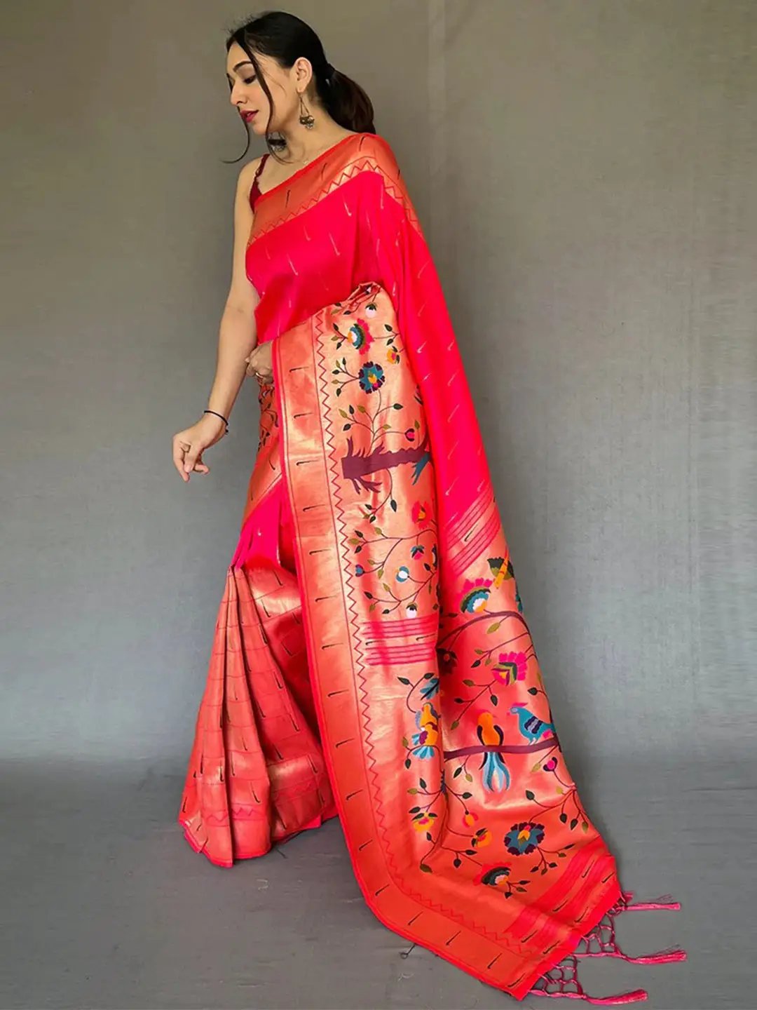 Side view of pink Paithani saree with intricate zari work