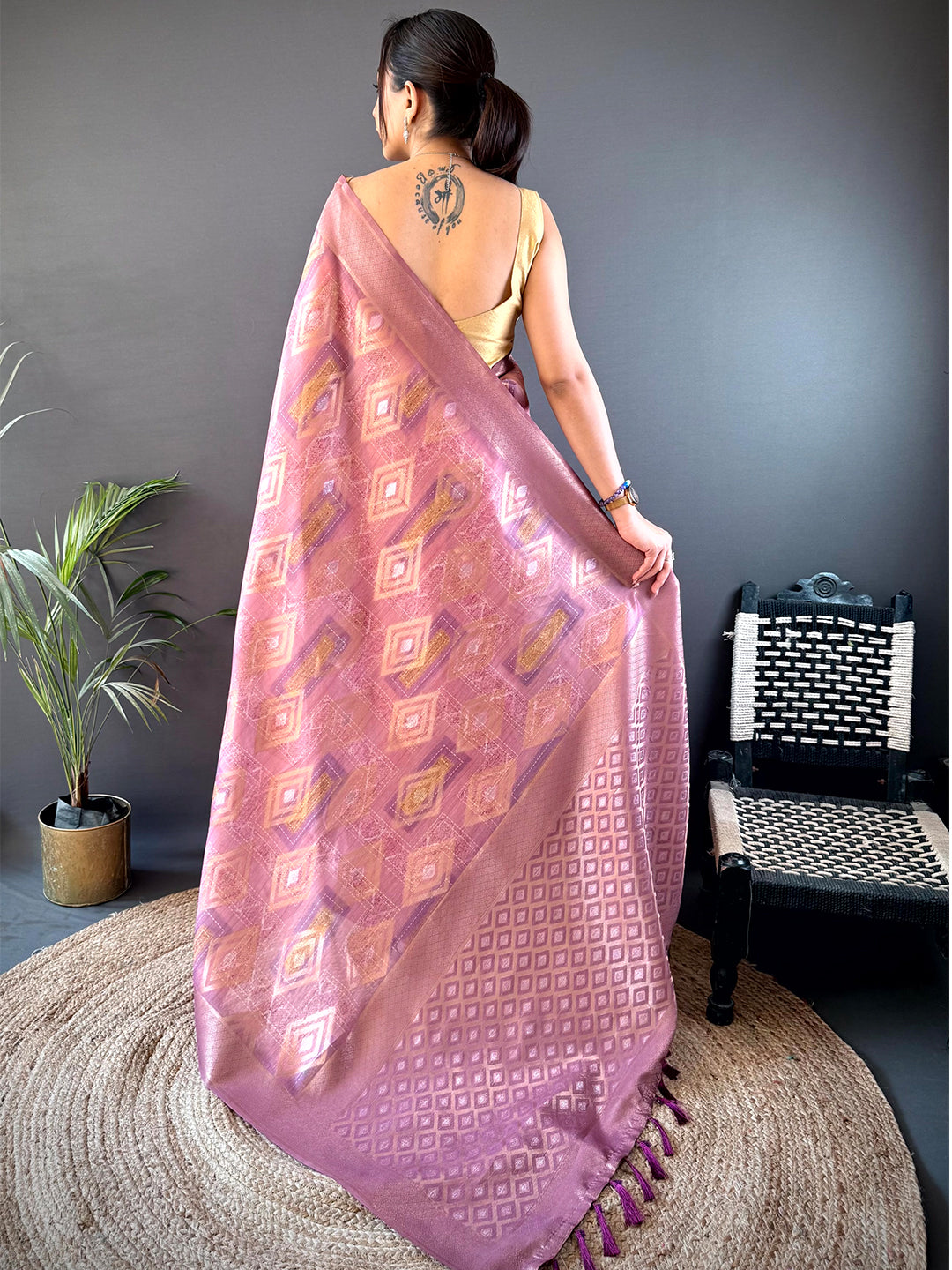 Back view of Blush Pink Banarasi Silk Katan Geometric Saree showcasing exquisite craftsmanship and traditional woven designs.