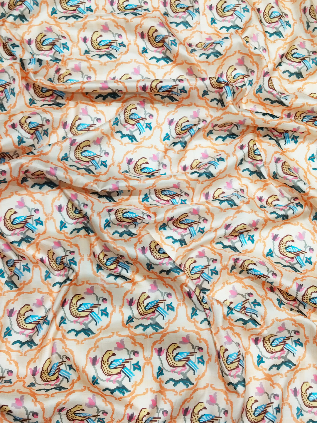 Close-up of Patola print on cream Kanjivaram saree fabric