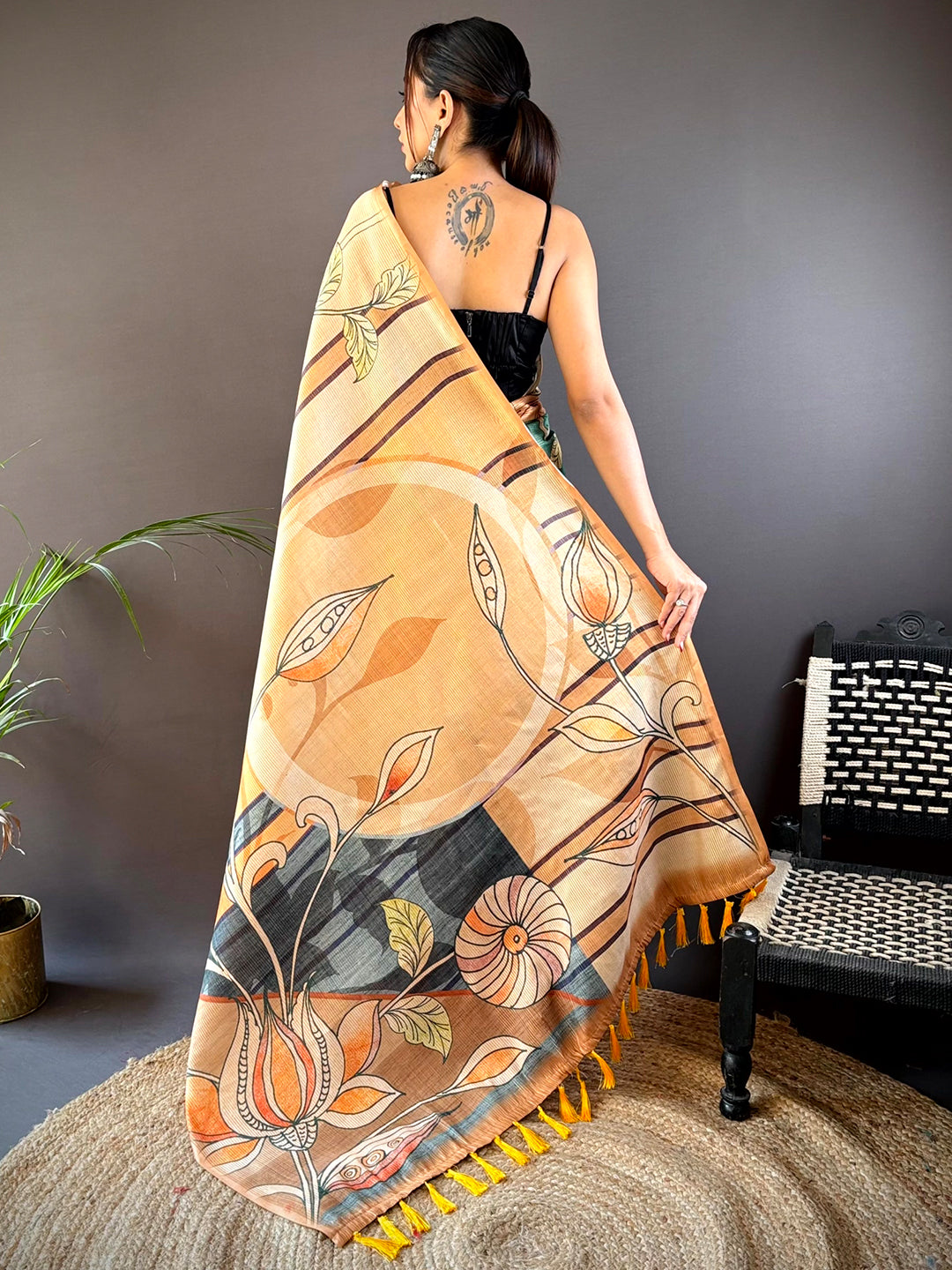 Back view of Peach Zari Tussar saree showcasing floral pattern