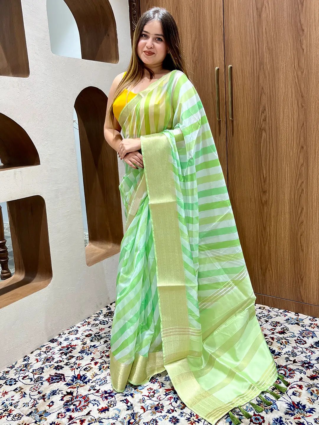 Elegant organza leheriya saree with green and yellow pattern