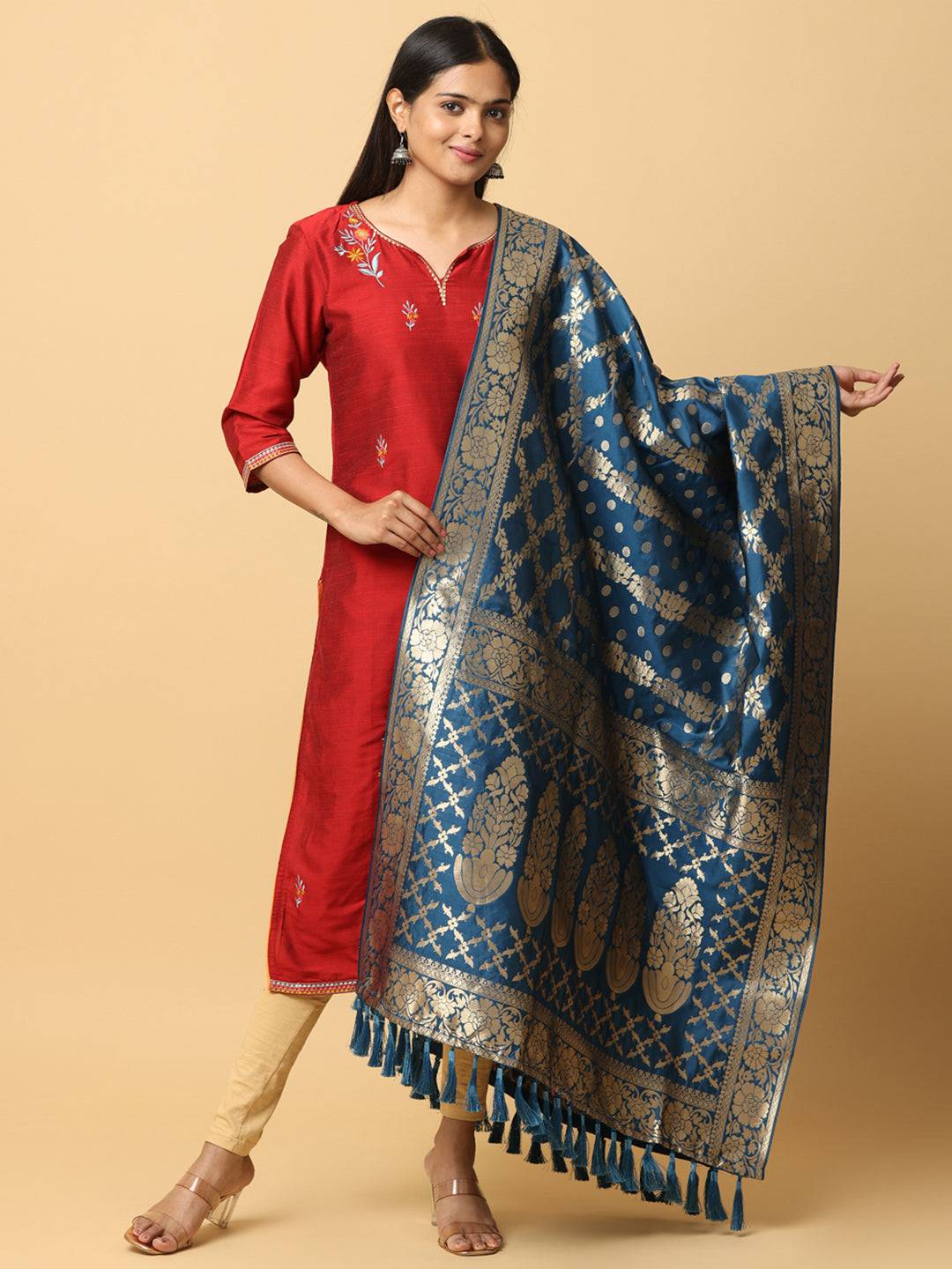 Silk blend woven dupatta with intricate design and tassels.