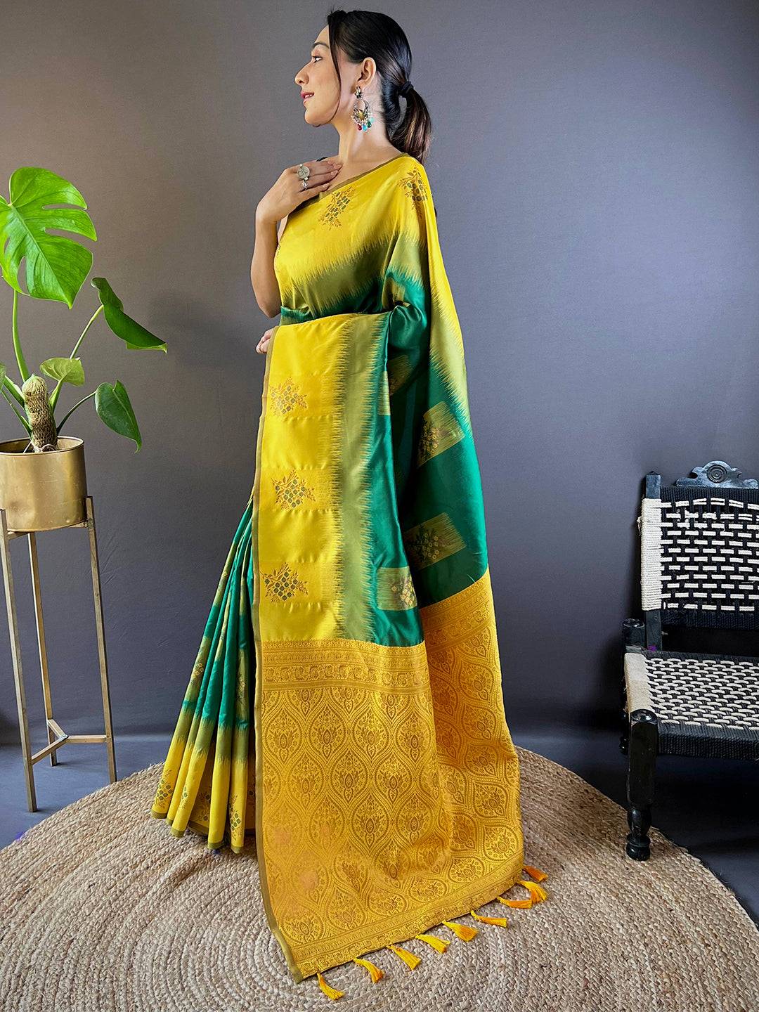 Side pose of model in dark green Sami Banarasi Tussar silk saree