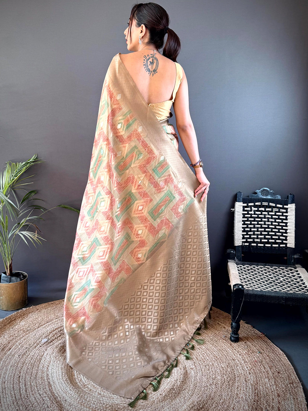 Back view of Beige Banarasi Silk Katan Geometric Saree showcasing intricate woven details and elegant drape, ideal for festive and party wear.