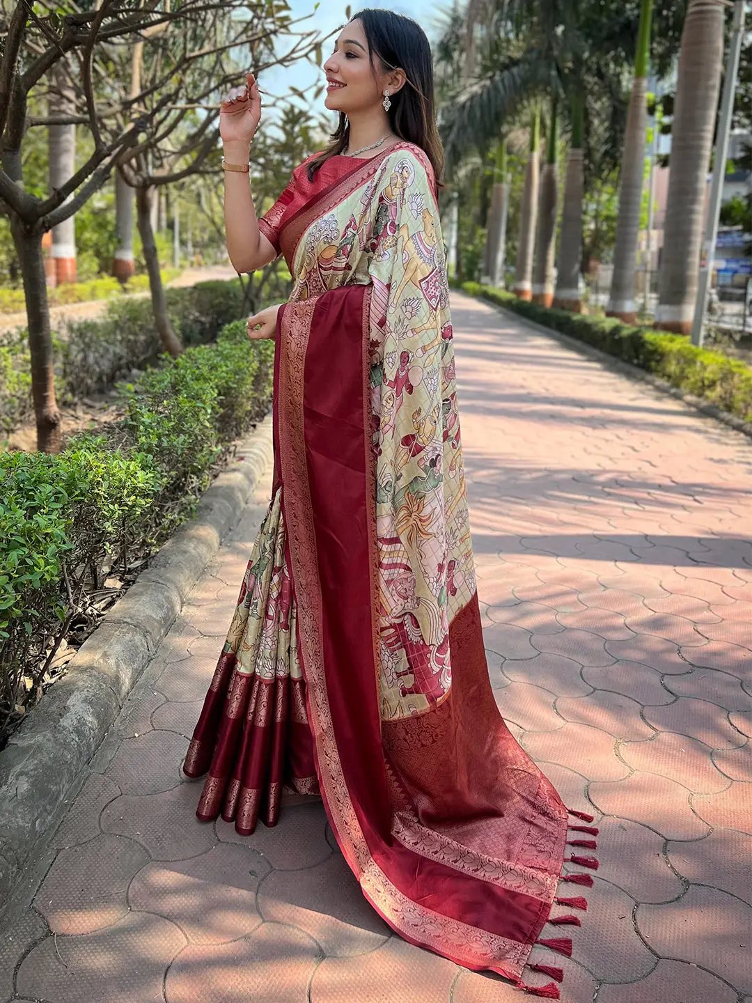 Side view of woman wearing red Banarasi silk saree outdoors