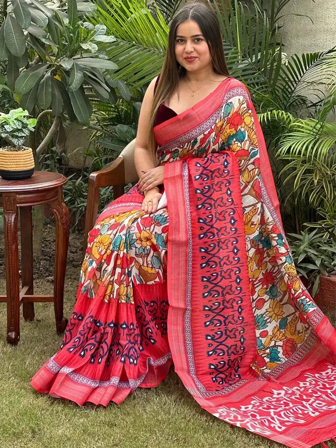 Floral Ikkat Printed Saree draped elegantly in garden setting