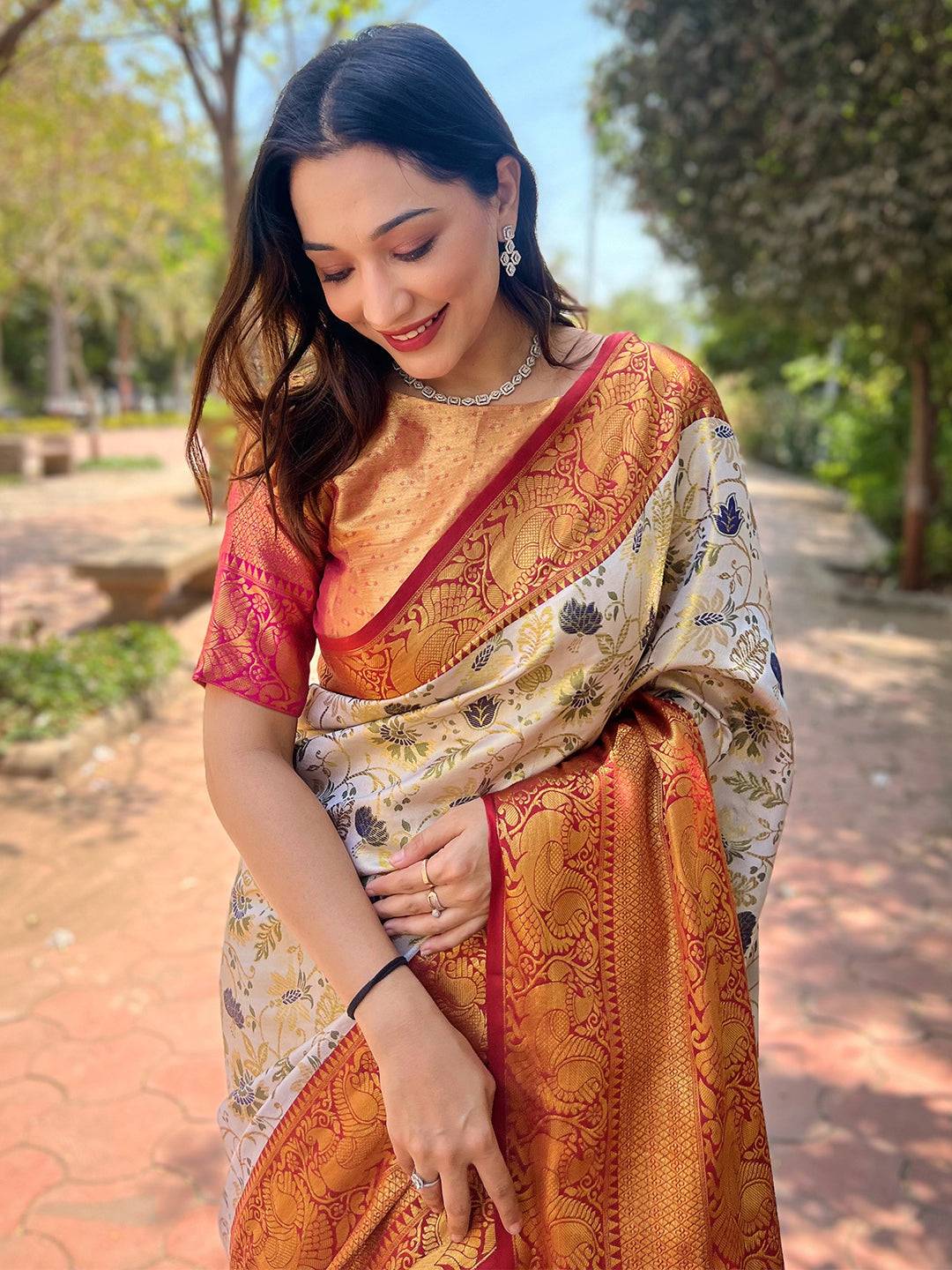 Woman in red and gold Banarasi silk saree outdoors