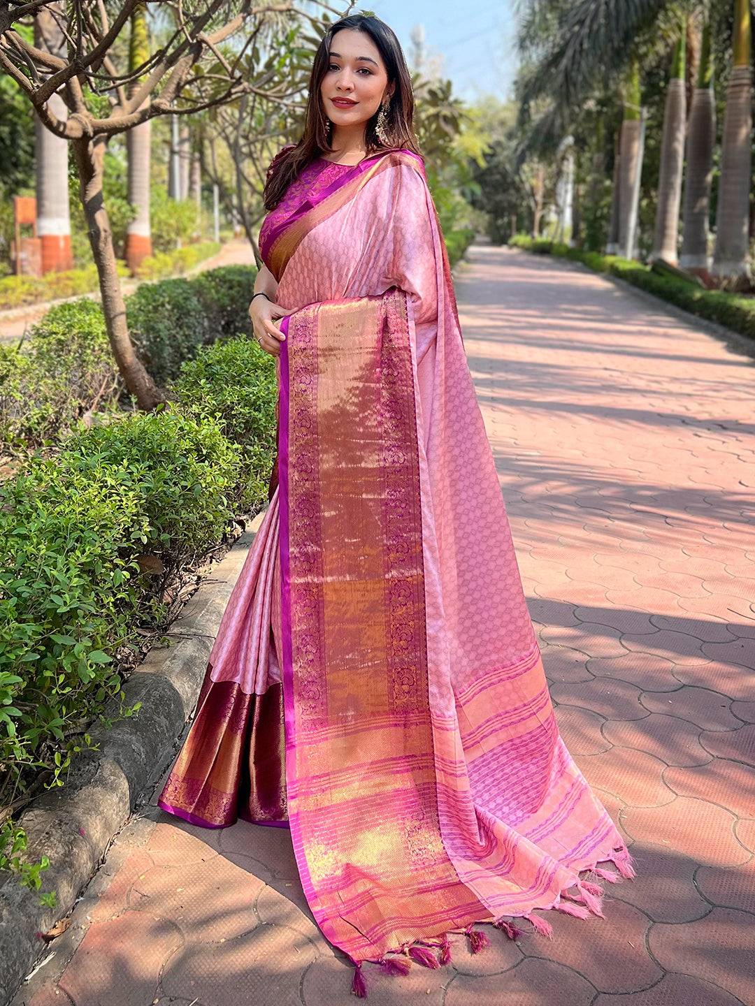 Traditional pink Kanjivaram saree with gold zari details