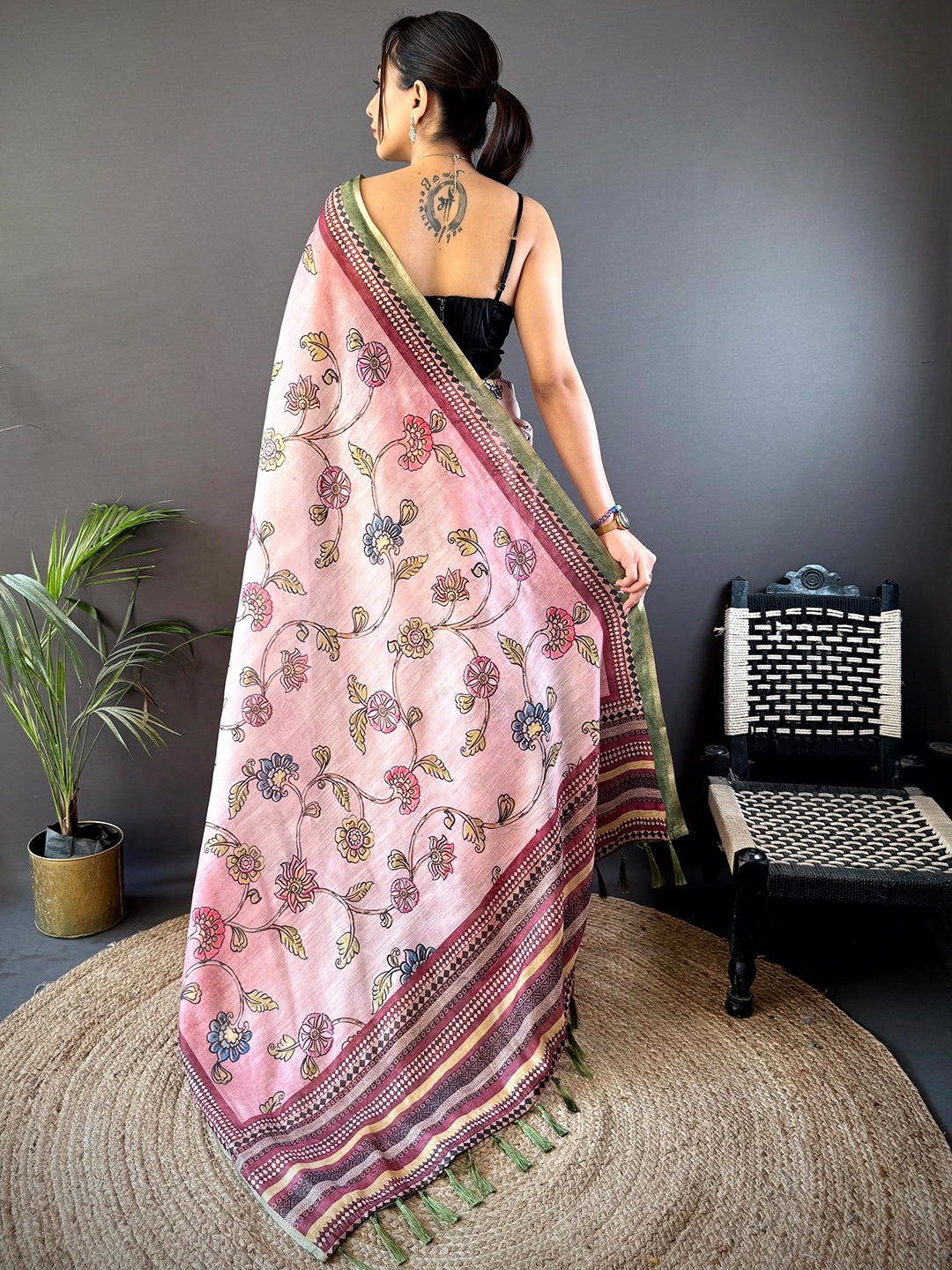 Back view of Rose Pink Zari Tussar Floral Saree showcasing exquisite floral patterns and a rich zari border, perfect for traditional events.