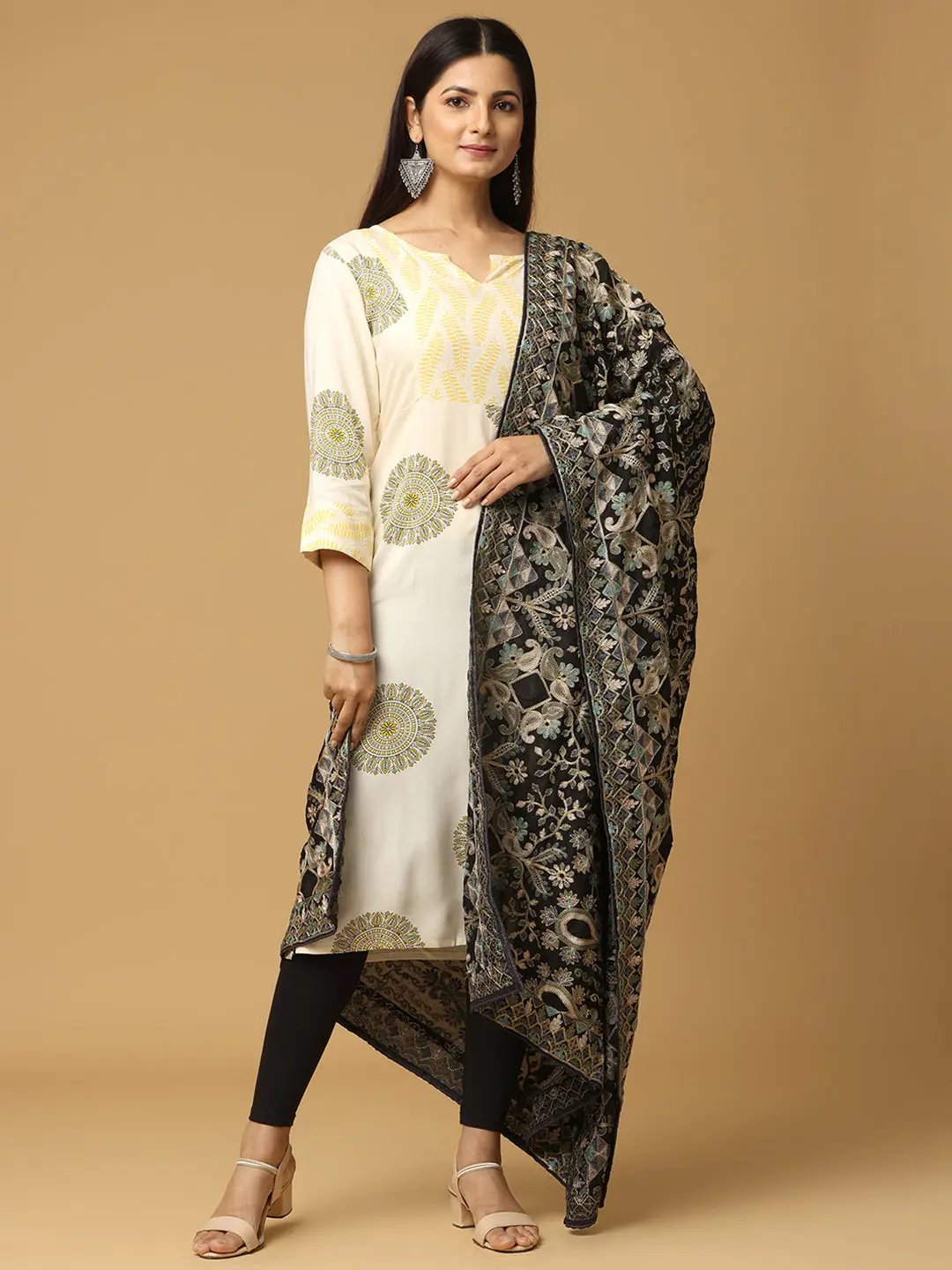 Model wearing black chiffon dupatta with ethnic patterns.