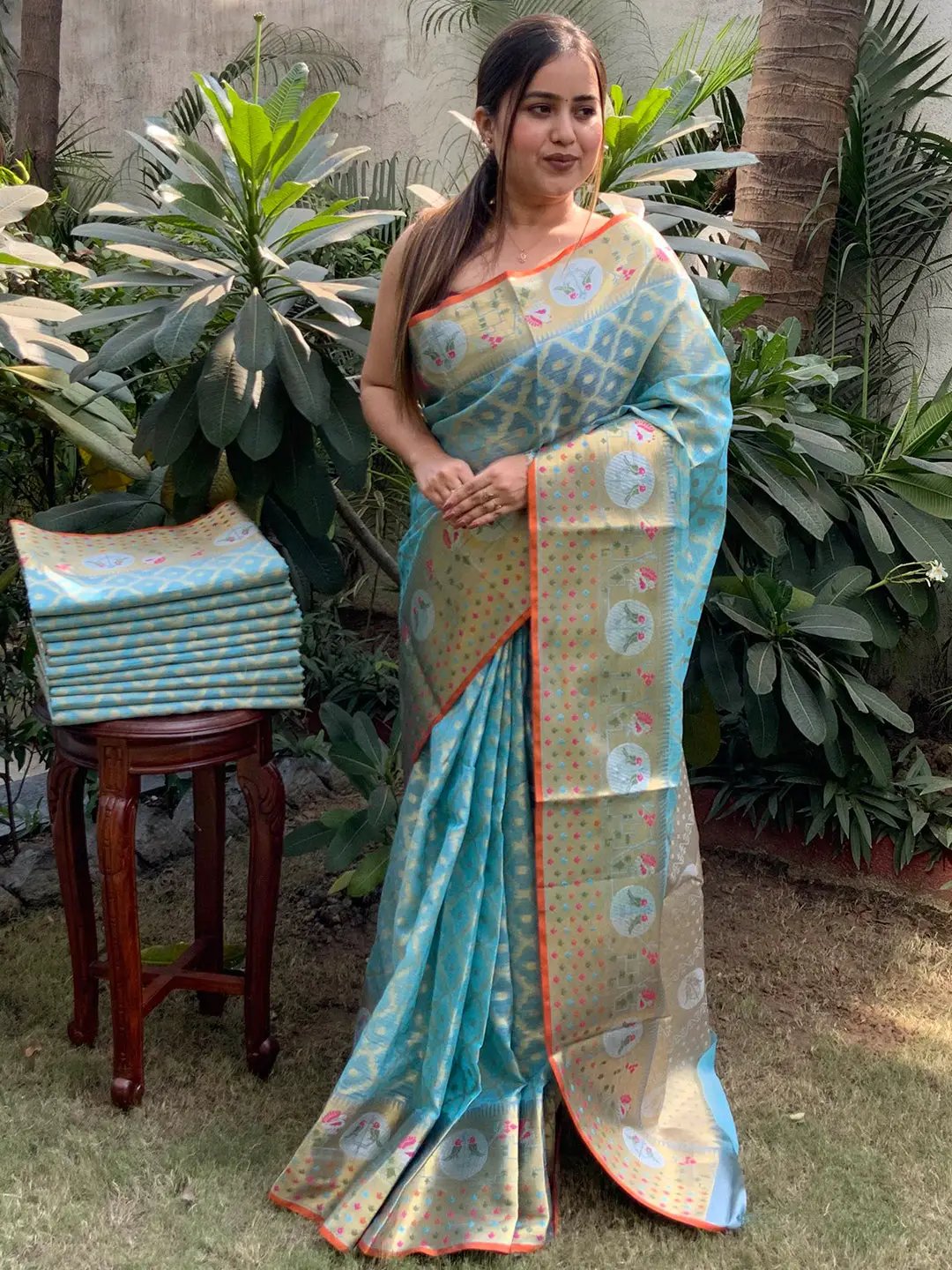 Woman in blue and gold Kota Doria Silk Saree with intricate designs